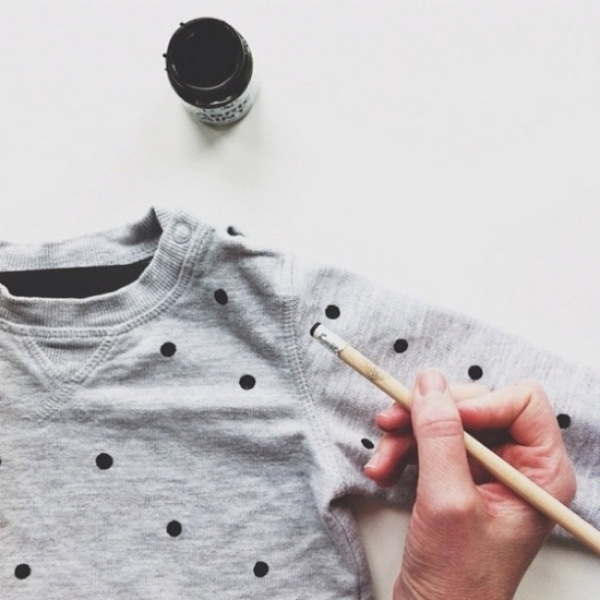 I Love the Simplicity of this DIY Allover Polka Dot Print on a Kids Sweatshirt. Simply buy fabric paint, dip the eraser end of a pencil in the paint, and place dots on a Sweatshirt! How easy is that? I have to try this DIY for my son and for myself! Just don't forget to place a layer of cardboard or scrap paper between the fabric layers of the sweatshirt to prevent the ink from bleeding through! And if you’re using a fabric paint that requires heat setting, turn the sweatshirt inside out and place scrap paper between the layers of fabric, then press according to the instructions on the paint package.