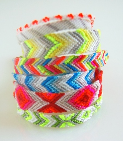 These Molly's Sketchbook: Friendship Bracelets from the purlbee.com are macraméd friendship bracelets. The Purl Bee also has easy to follow step by step instructions with photos for making these Friendship Bracelets-- they make it look so easy I have to try making one for myself-- with fluorescent embroidery floss :-)