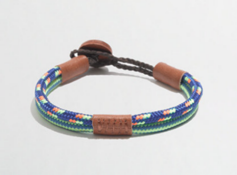 This J.Crew FACTORY BOYS' CORD AND LEATHER BRACELET is in cotton with leather button and trim.