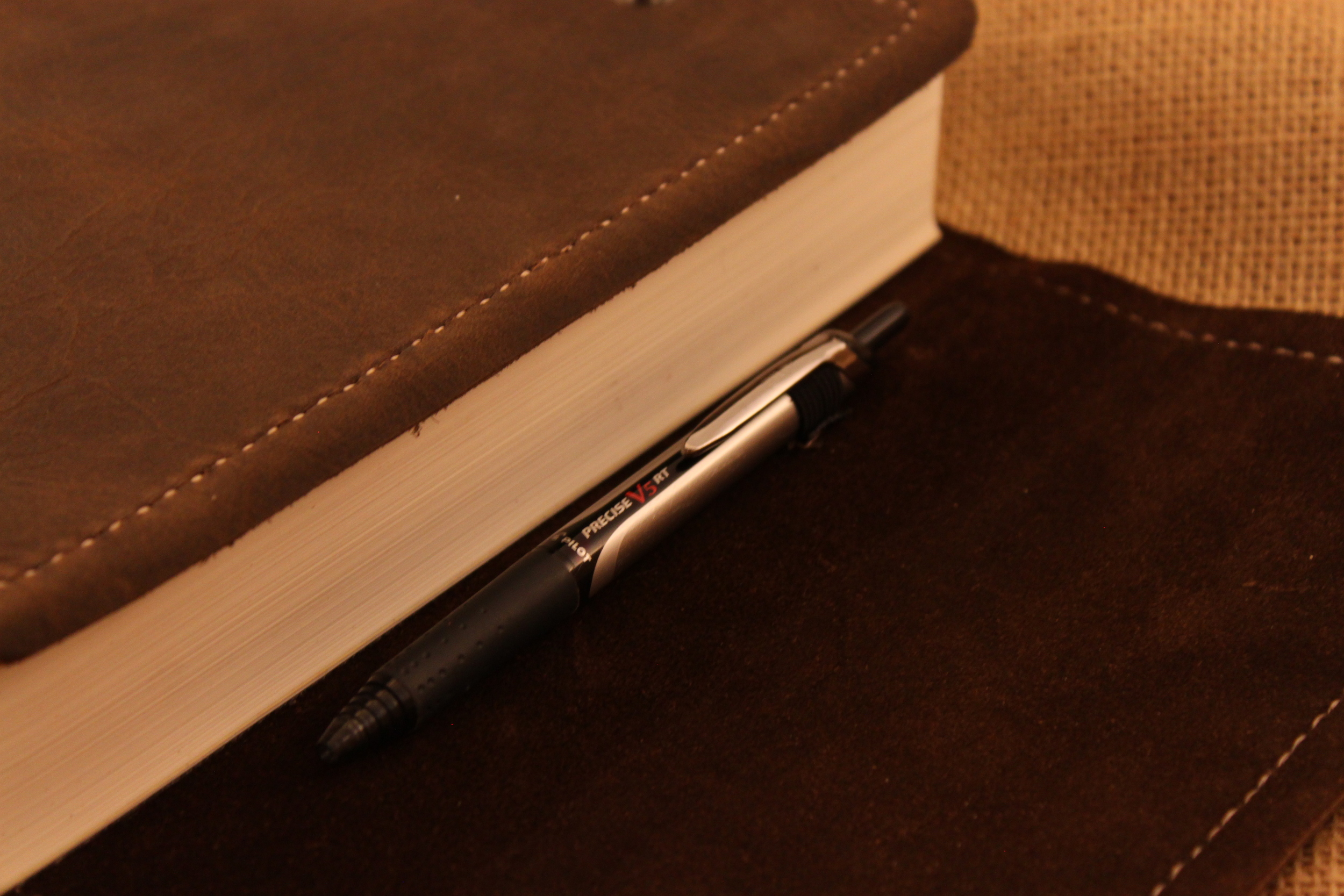 Pen holder from inside - heavy duty elastic to accommodate a variety of pens, pencils or small highlighters.
