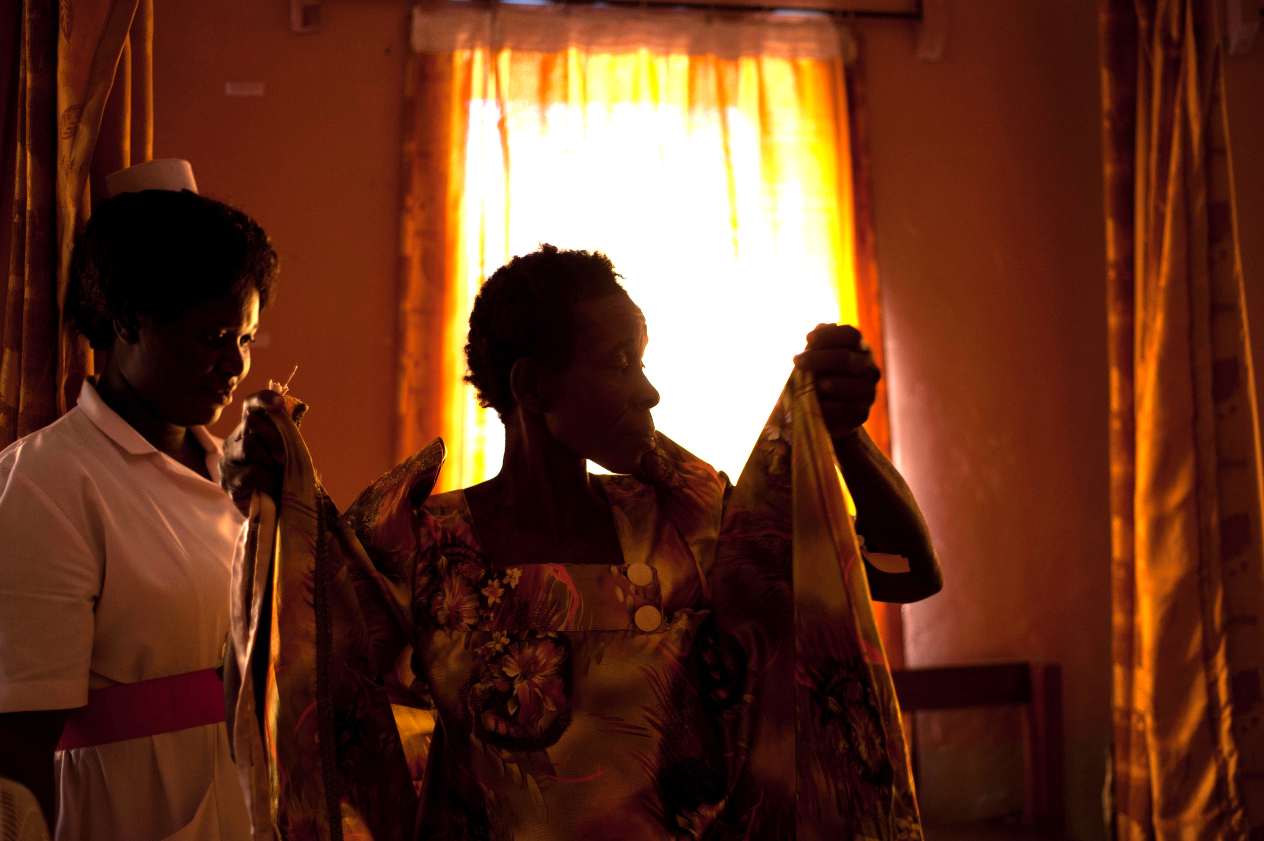  A patient dresses after a scan,&nbsp; Kamuli, Uganda.  