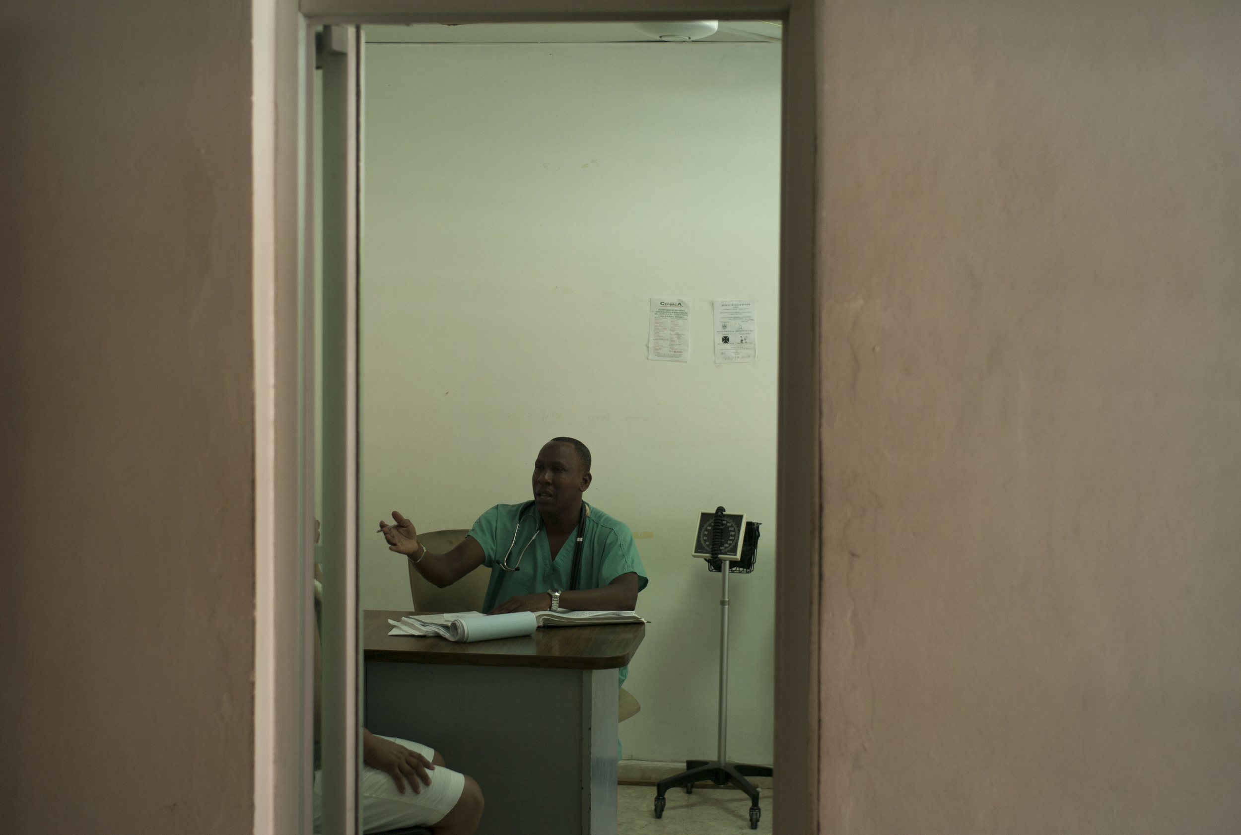  A doctor talks with a patient,&nbsp; Paraiso, Dominican Republic.  