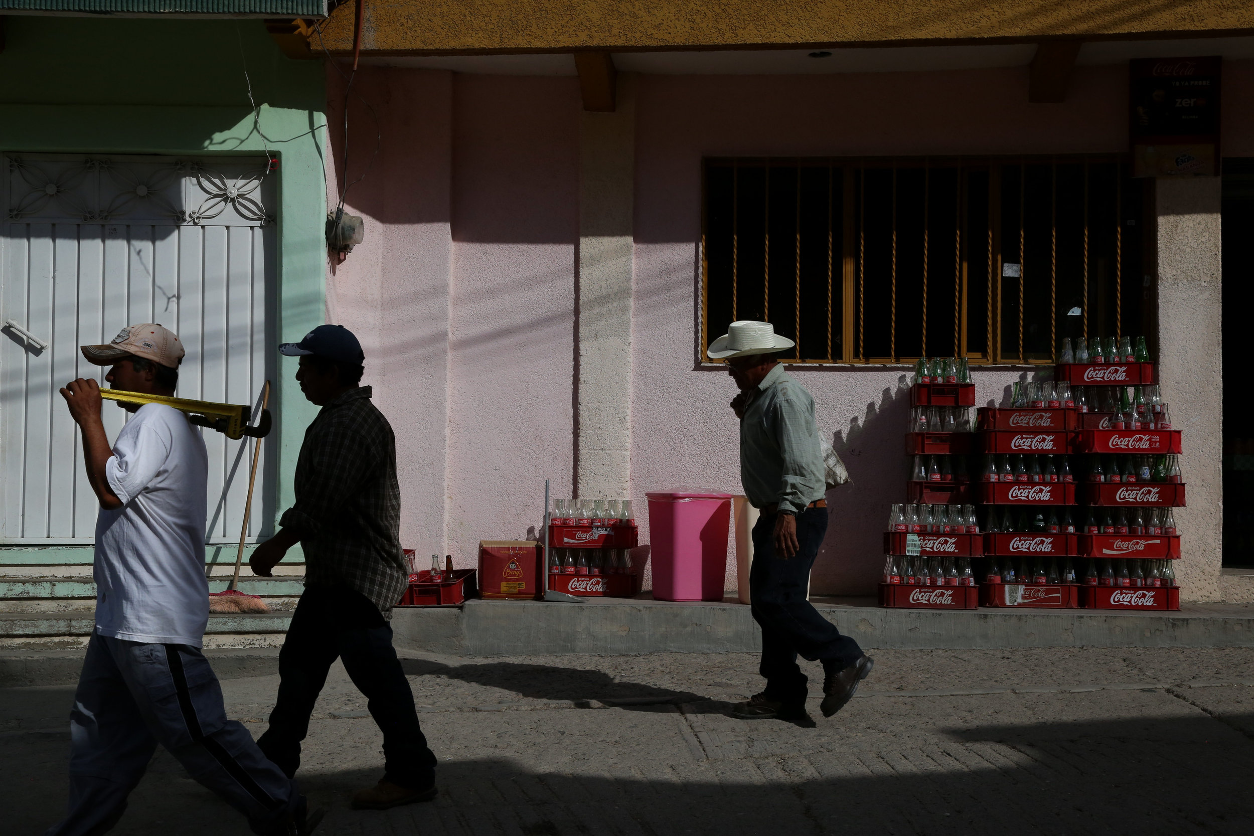  Day laborers walk to work in  San Miguel Allende, Oaxaca.  