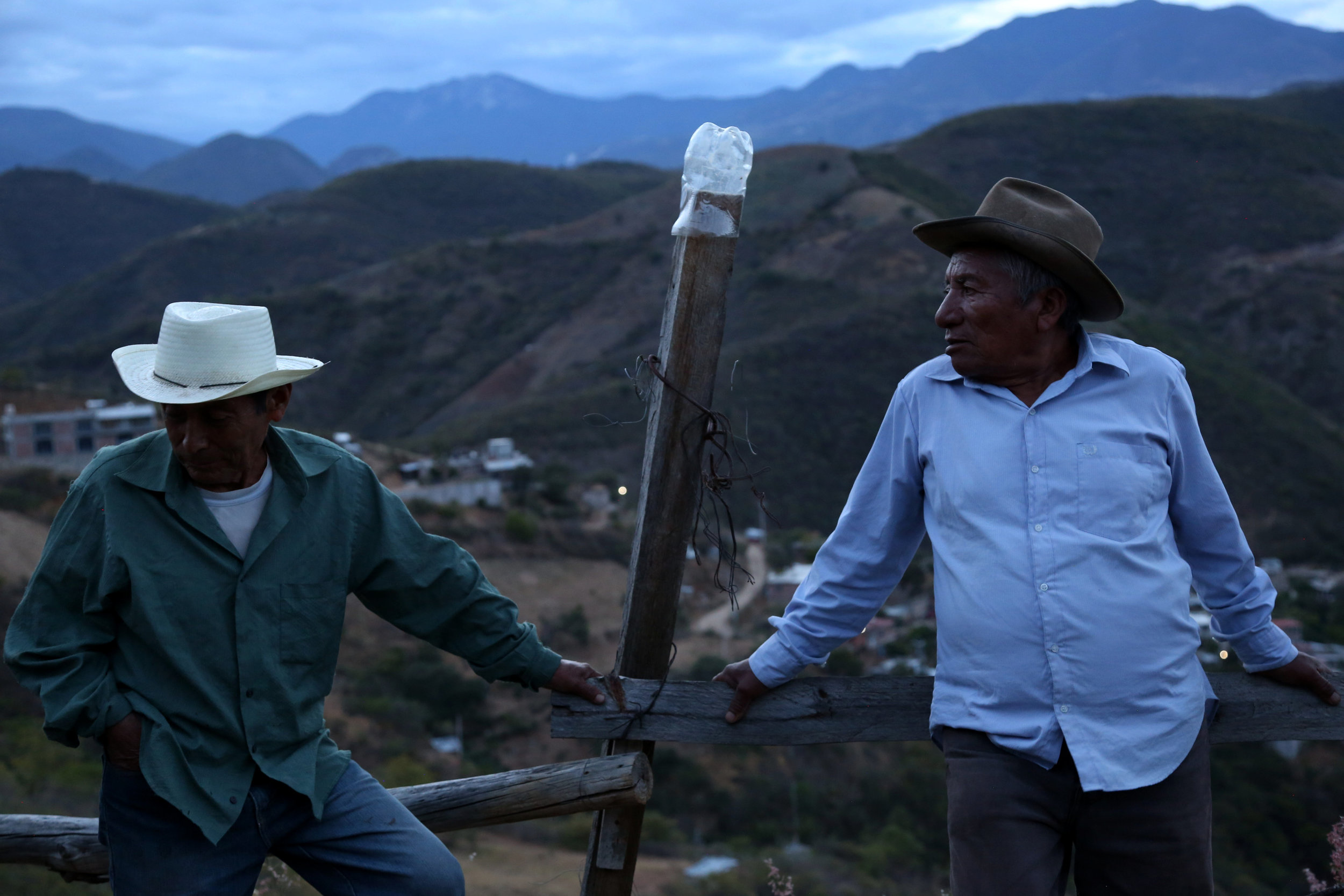  Arnulfo de los Angeles and Rodolfo Hernandez sit at the palenque that they share with Fortunate Angeles in  San Juan del Rio, Oaxaca.  