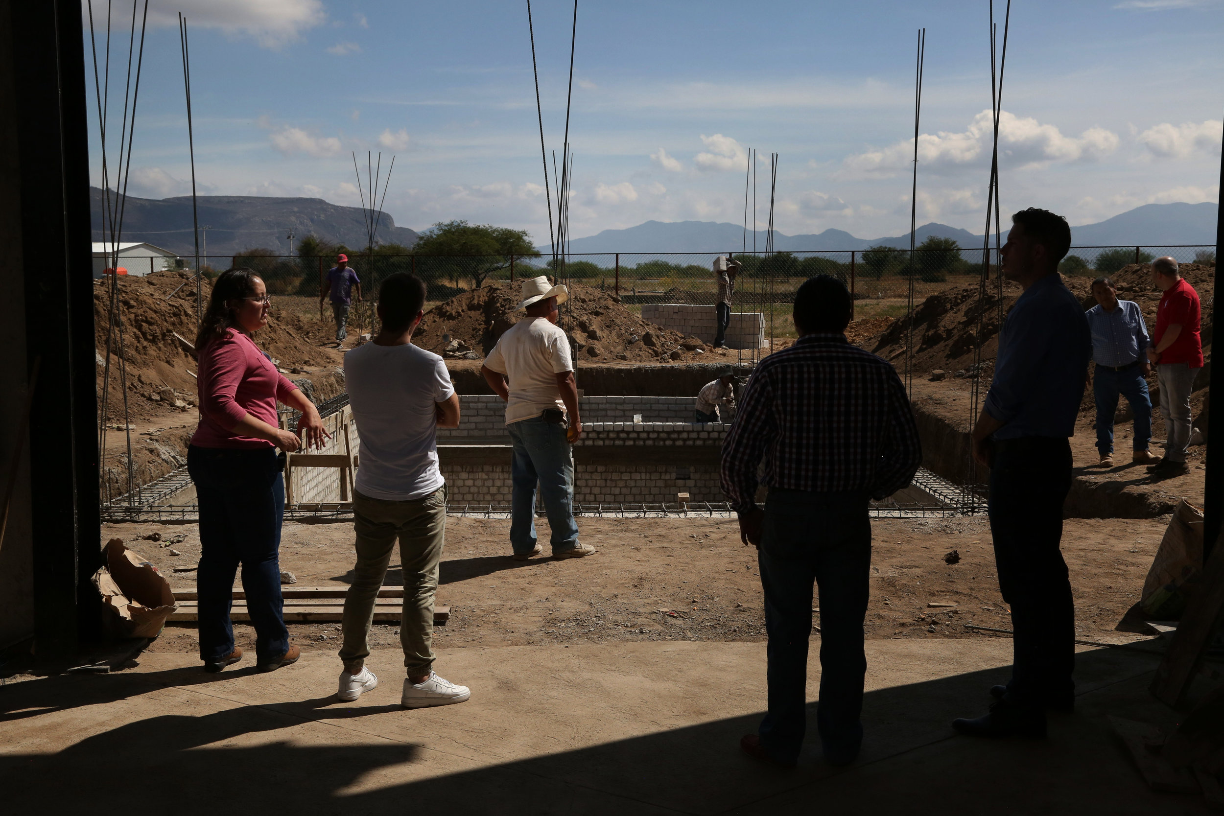  A team from Mezcal Amores tours the construction of a new facility for research and production of their Verde line in  Tlacolula, Oaxaca.  