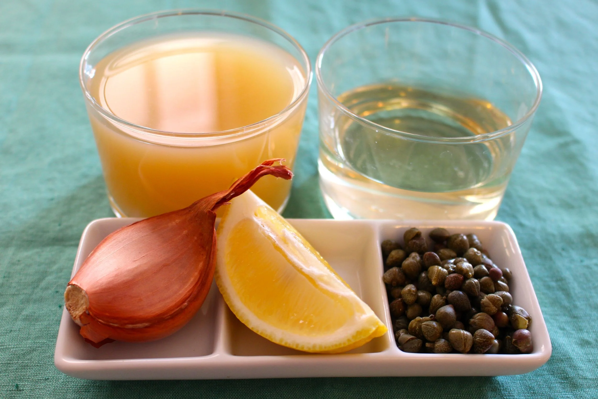 Key components of the sauce - stock, wine, shallot, lemon and capers
