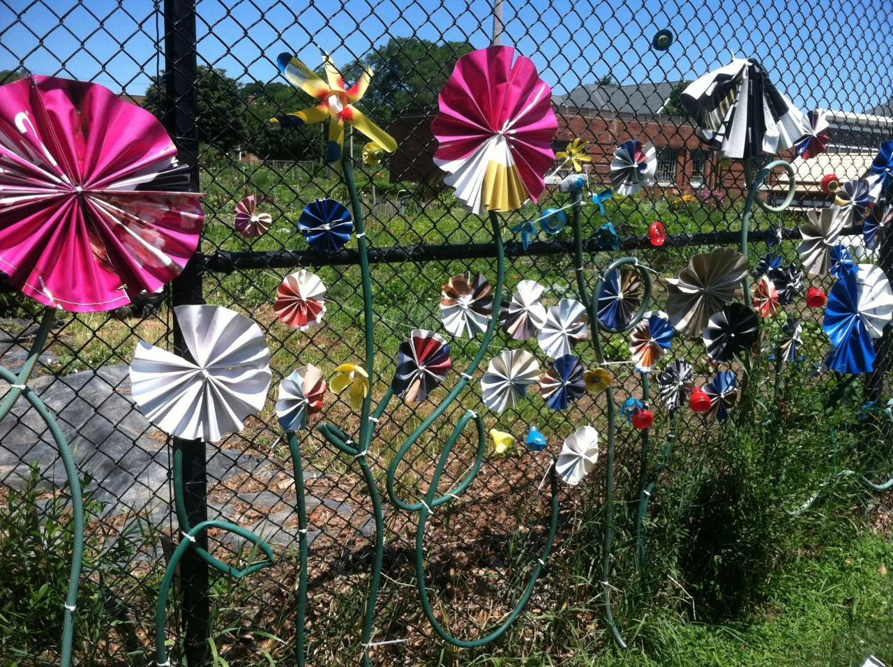 Thanks to our friends at LAND studio, Upcycle Parts Shop led the community installation of this fun fence mural between Kentucky Gardens and Fairview Park in Ohio City. Have an old garden hose lying around your yard? We'll take more! See more things Upcycle Parts Shop takes as donations here . 