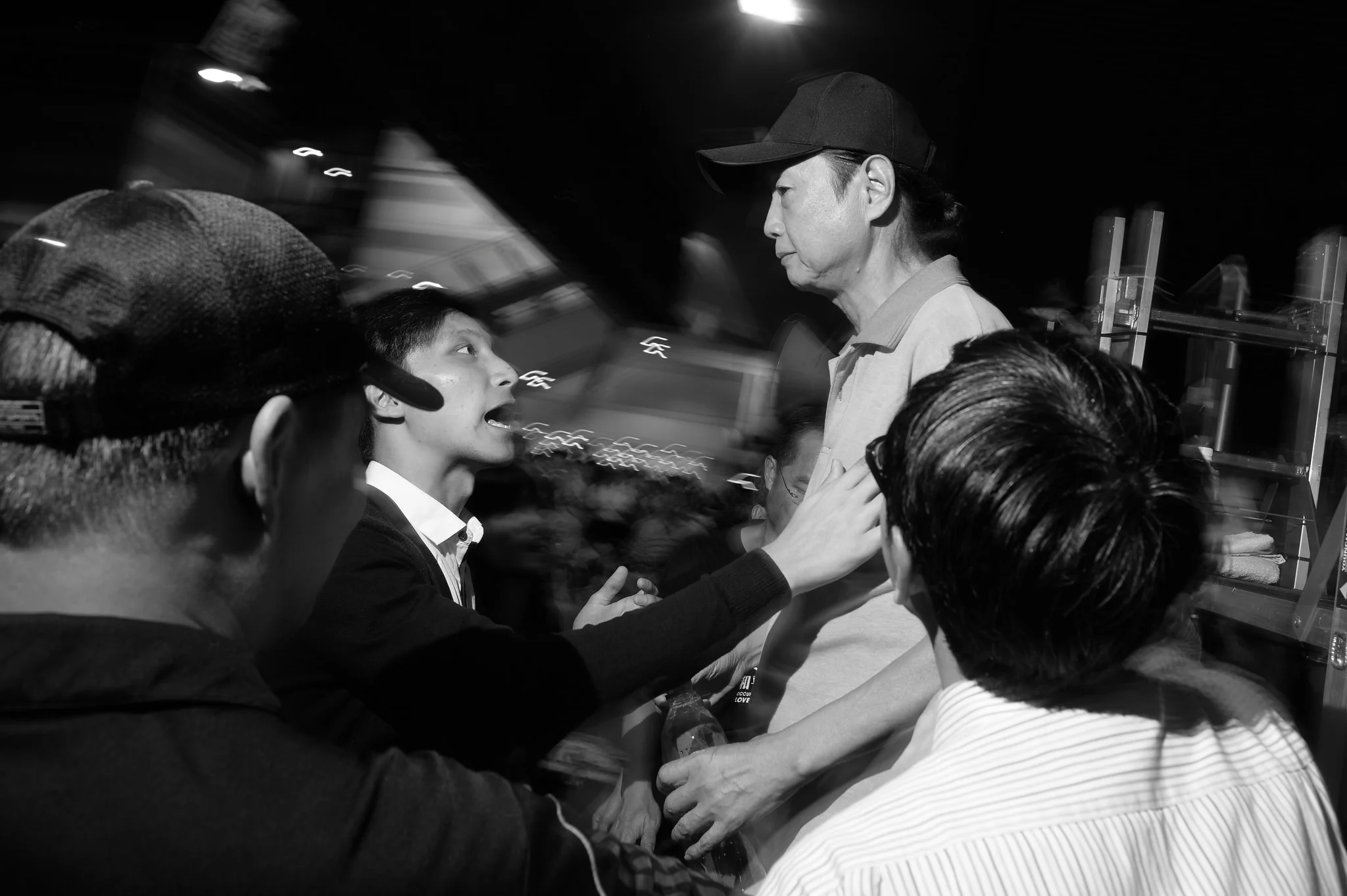 An older man is booed and pulled from the main stage in Admiralty after expressing the view that students should be happy with their achievements and return home. In a display typical of the civility at Admiralty, students later sat on the ground and amicably discussed their differing opinions with the man for several hours.