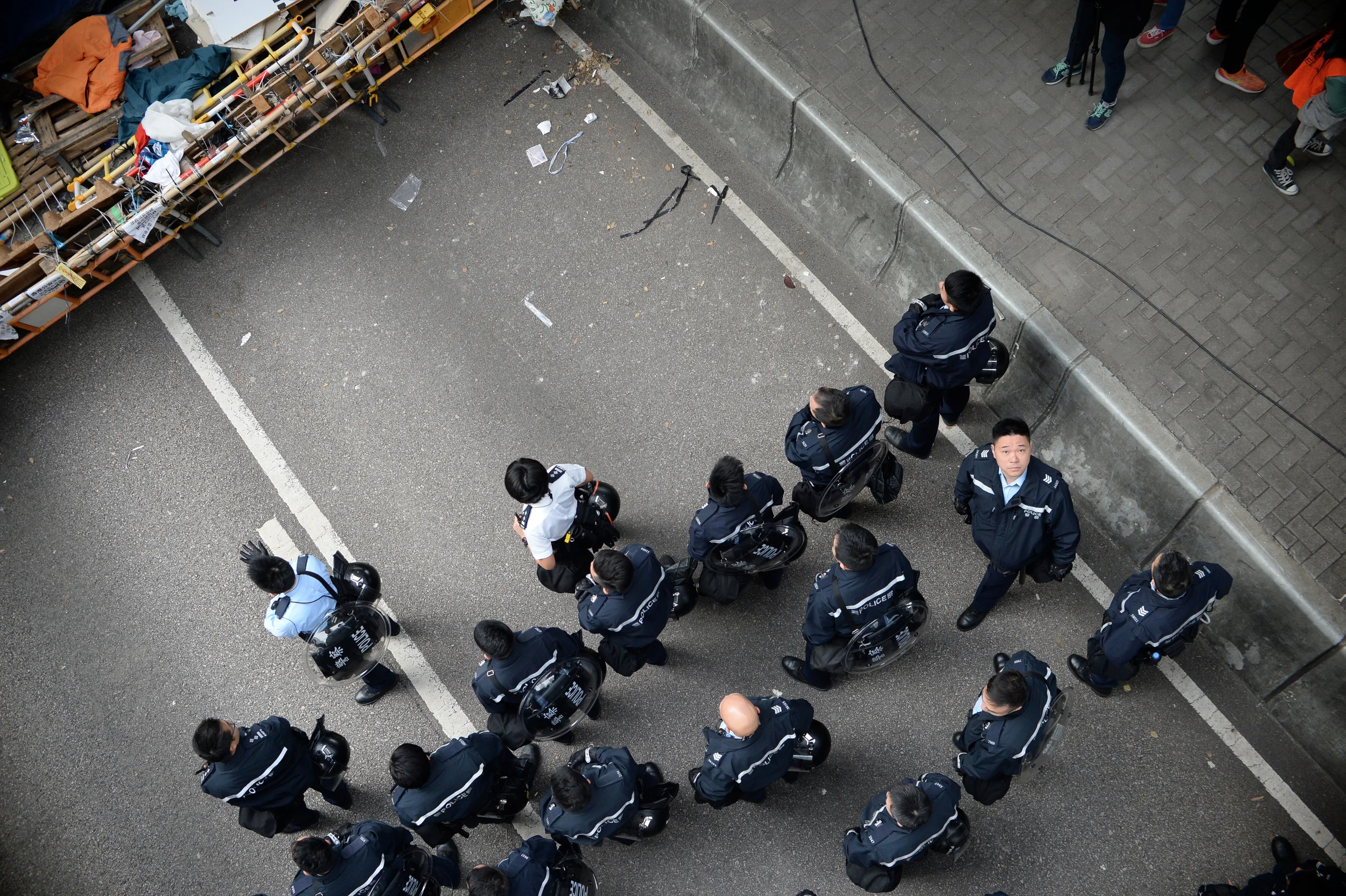 On December 11th, the 75th day of the occupation, thousands of police executed an injunction to clear the remaining sites. They faced little resistance, in stark contrast to the events of September 28th. A few hundred protestors refused to evict the site, and waited mostly passively to be arrested. 