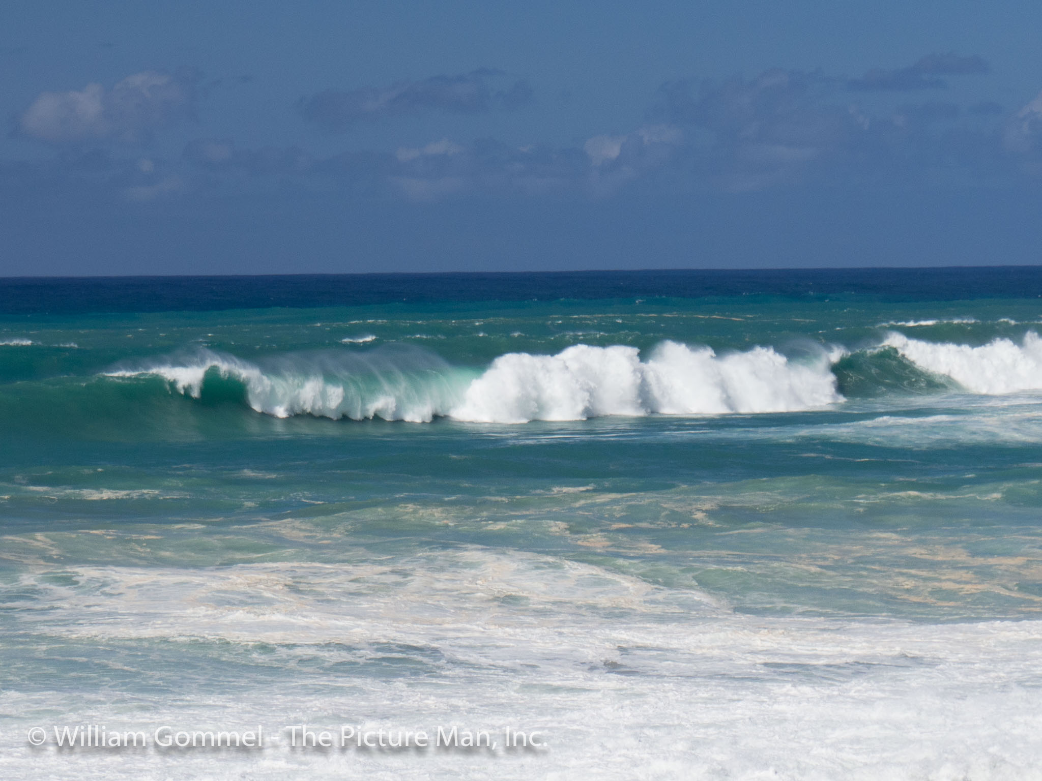 This image was from the area known as Pipeline and the lens does not do justice to the size of the wave.