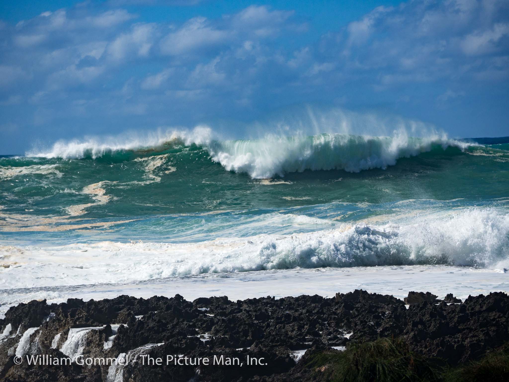 These two images were taken at Wiamea Bay and you can see and feel the power. While I was taking these images, a surfer climbed over the tape signifying the beach was closed and immediately the lifeguards were there making him leave the beach. I asked him how big these swells were and he estimated them at about 30 feet.