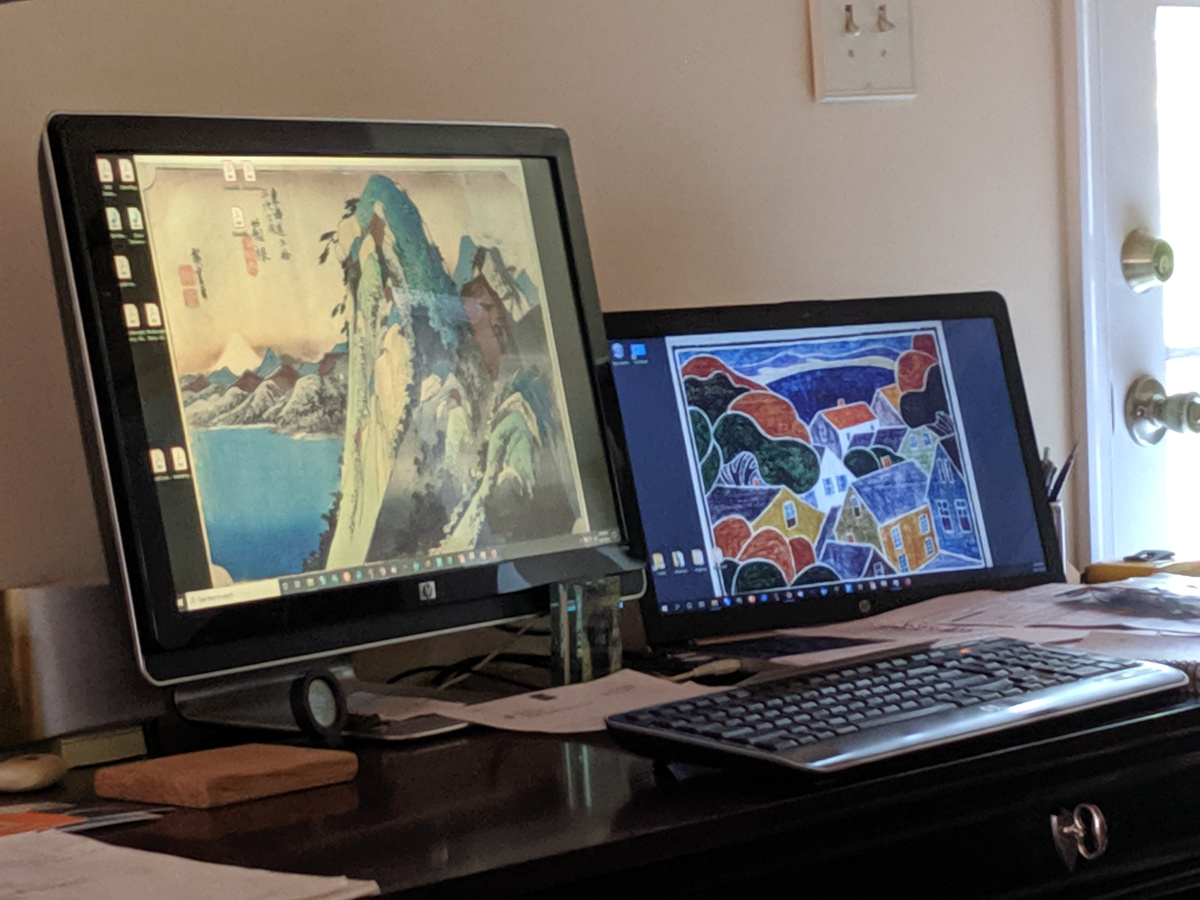 my desk; screen saver rotating thru my favorite block prints