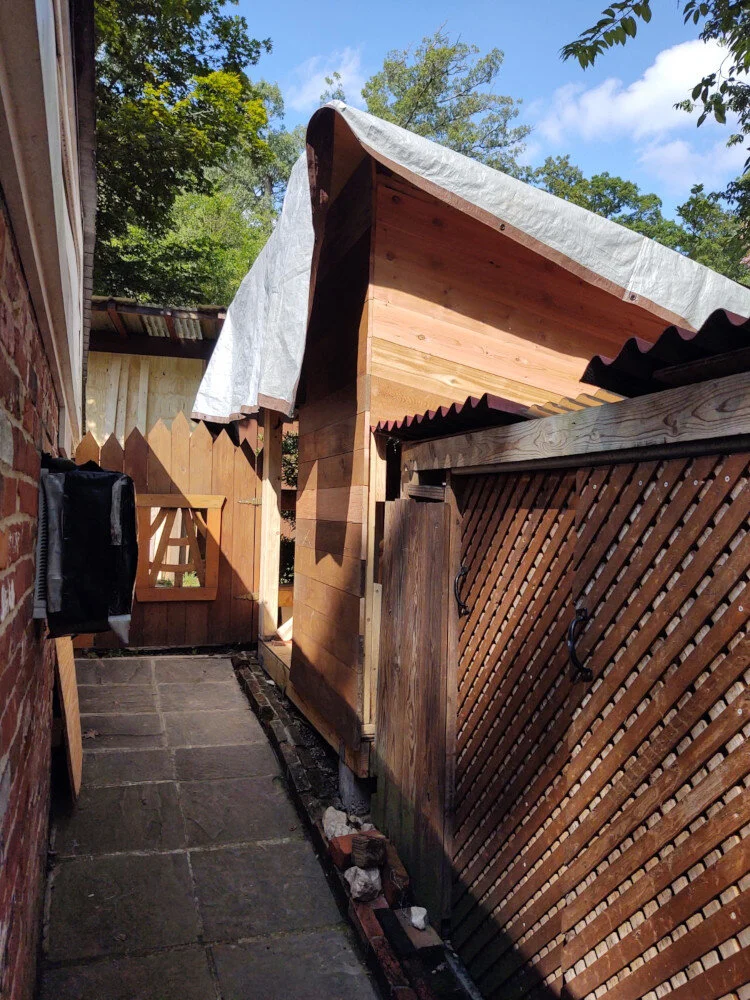 Many steps later, roof and siding mostly complete