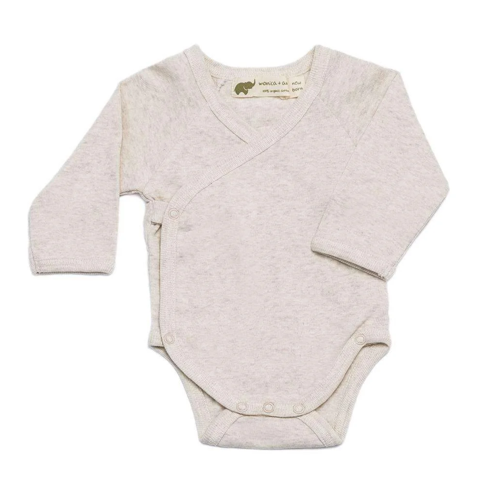 Newborn onesie from Monica + Andy for our baby. I love a fresh newborn in white, and this heathered cream gives the neutral a little more texture and interest. We bought this in size newborn and 0–3 month and will return the one that doesn't fit as well for newborn photos.