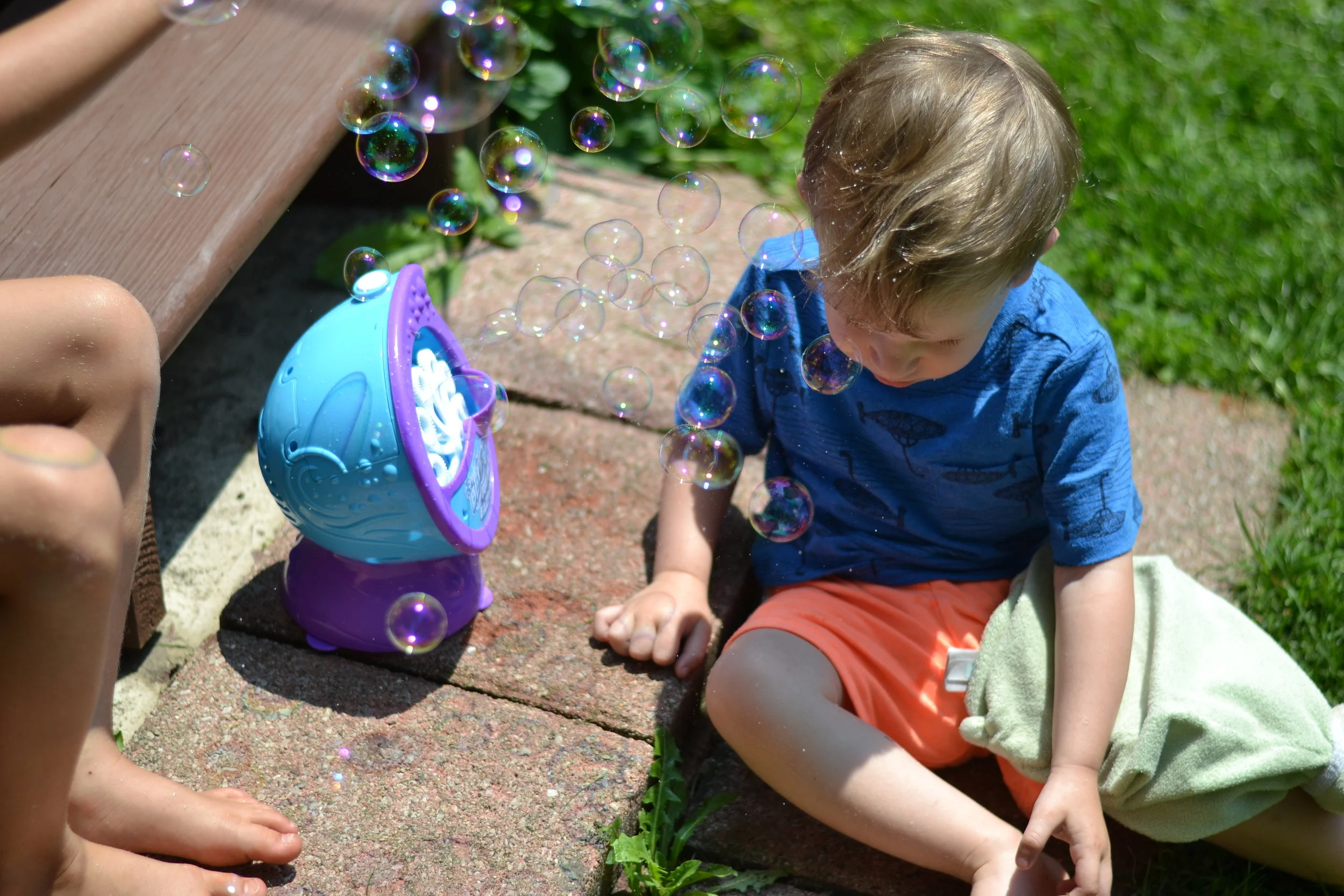 Theo enjoyed his new bubble machine with his cousins.