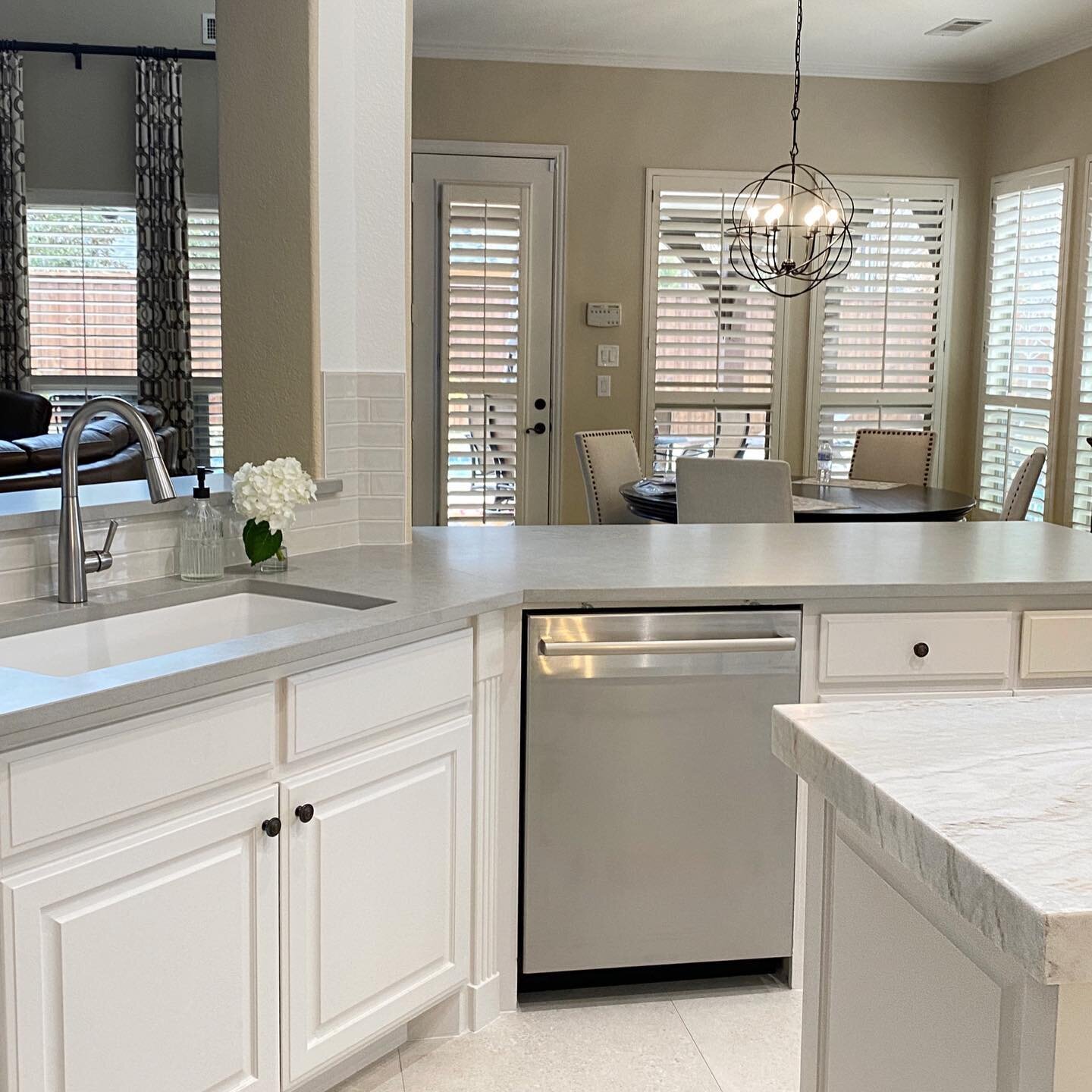 In this simple refresh, we eliminated the dated arched openings by squaring them off allowing for the opening to be larger.  And did you notice the overhang?  Once disconnected from the breakfast room, simply lowering the overhang connects the space 