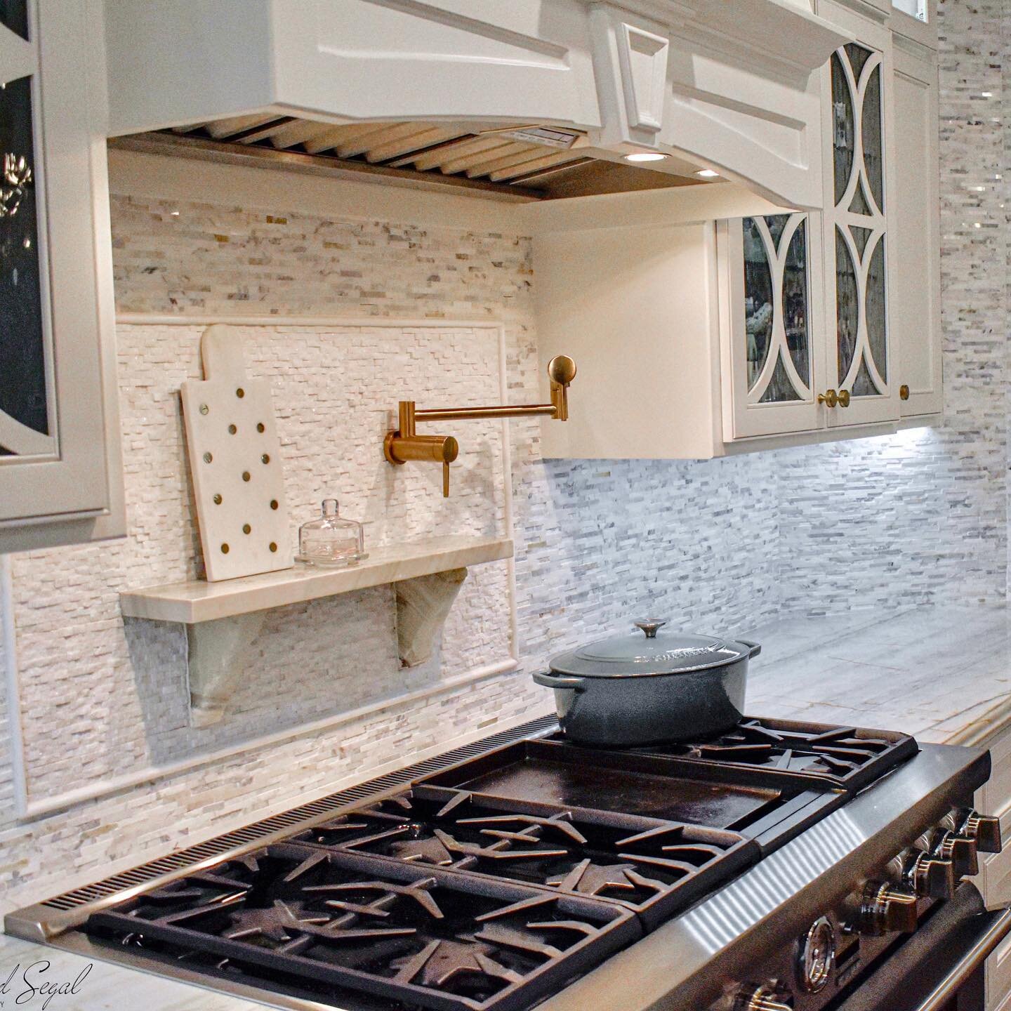 They say it's all in the details, right?  Check out this backsplash that wraps around and up two of the kitchen openings.  This mosaic was actually our second choice but who could tell?  Our original selection came in and clashed terribly with our be