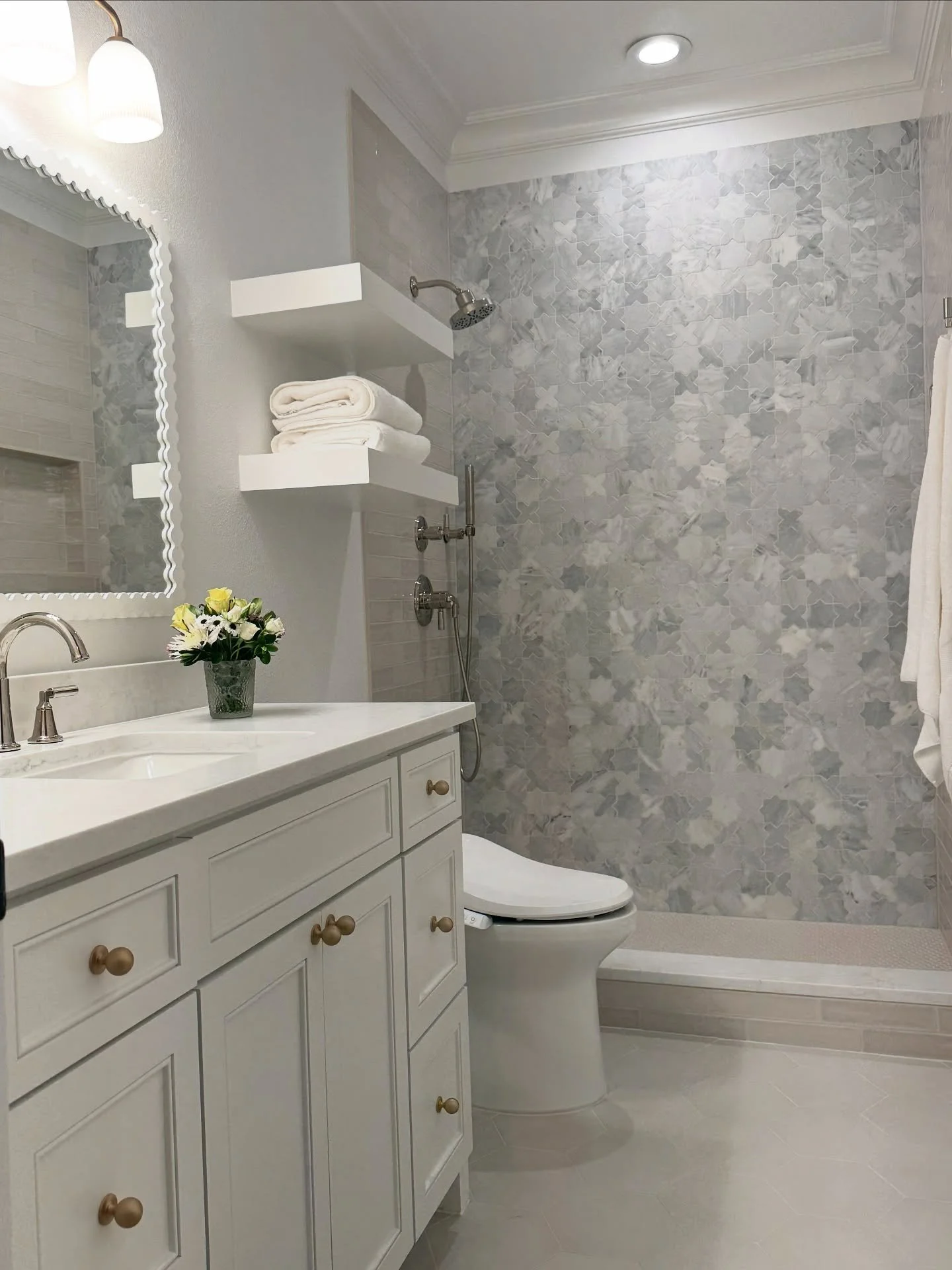 ✨ Girls&rsquo; Bath Glow-Up ✨
We took this space from dated and dark to fresh, clean, and serene! We removed the existing bathtub and created a custom walk-in shower featuring a mix of high-low materials that layer beautifully together.

Shower tile: