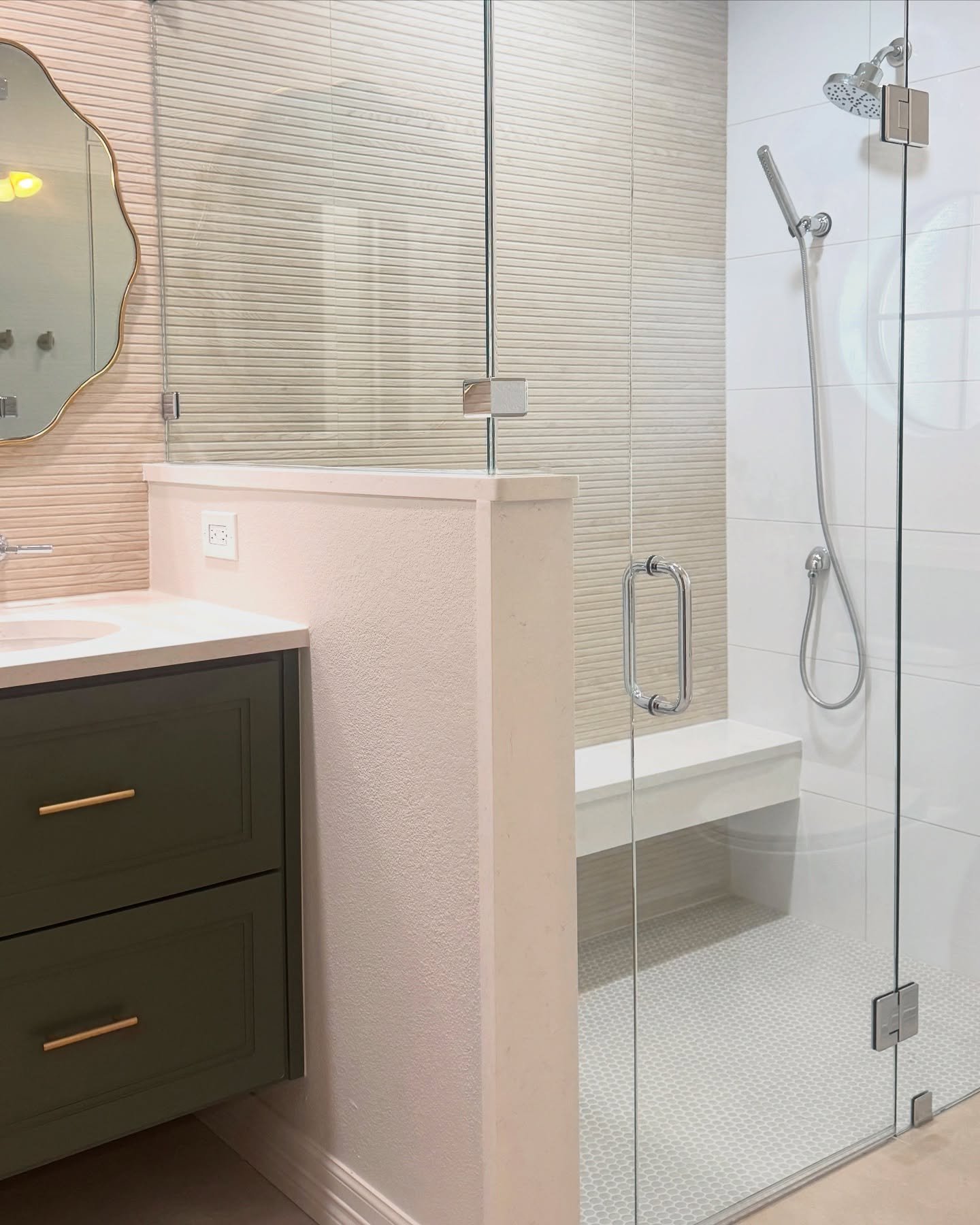 ✨Out with the old, in with the timeless ✨ 

This master bath transformation kept the original footprint but ditched the outdated sunken tub for a sleek, spa-like shower. A floating bench, linear drain, and built-in shampoo niches add both function an