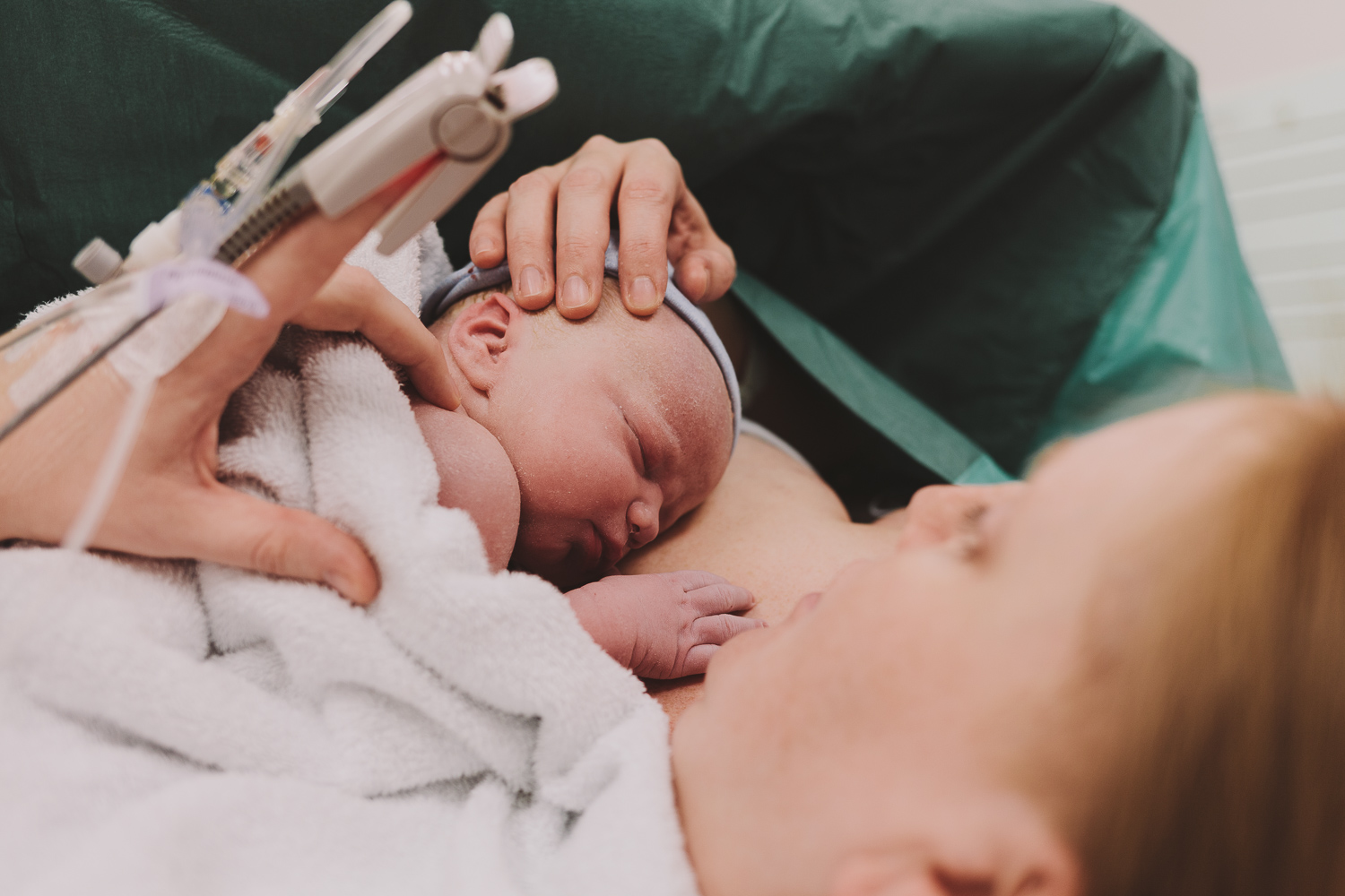 Alicia holds baby George for the first time