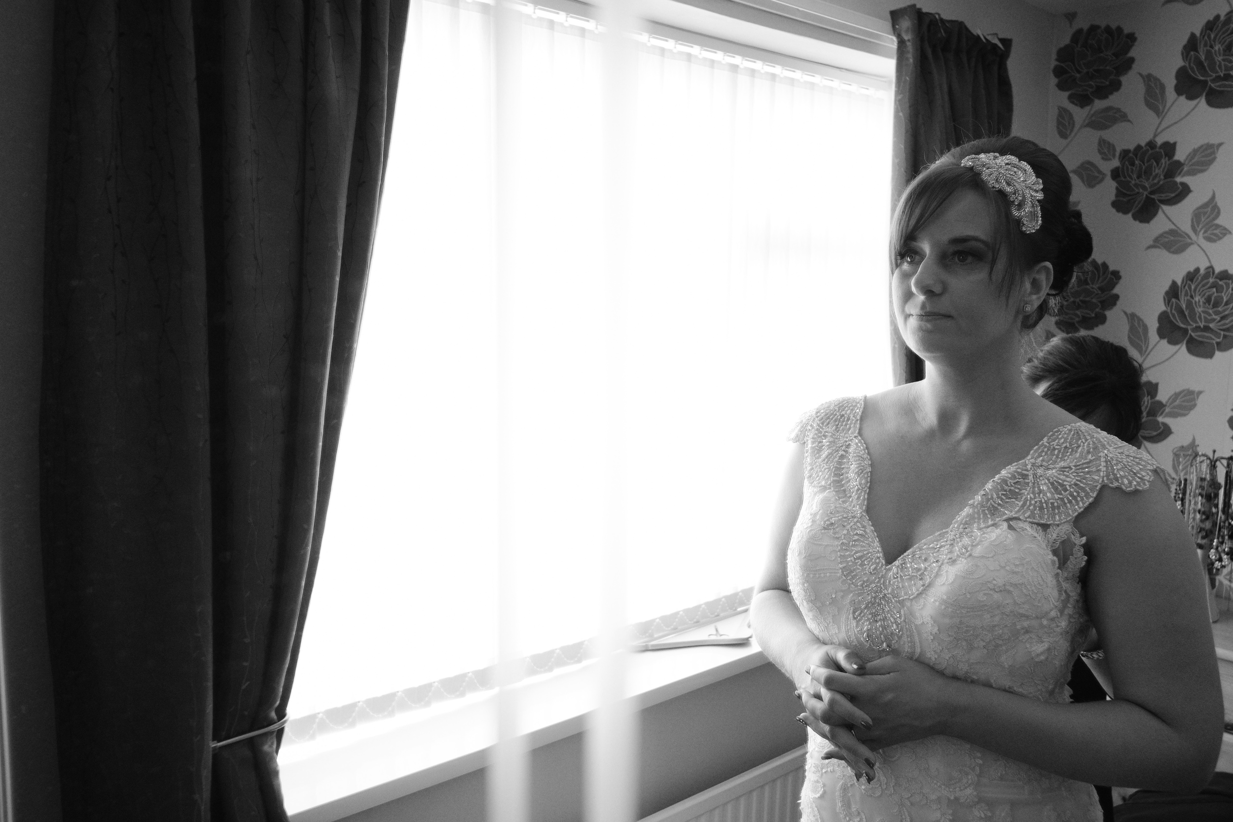 Newcastle Wedding Photographer // Bride getting into her wedding dress