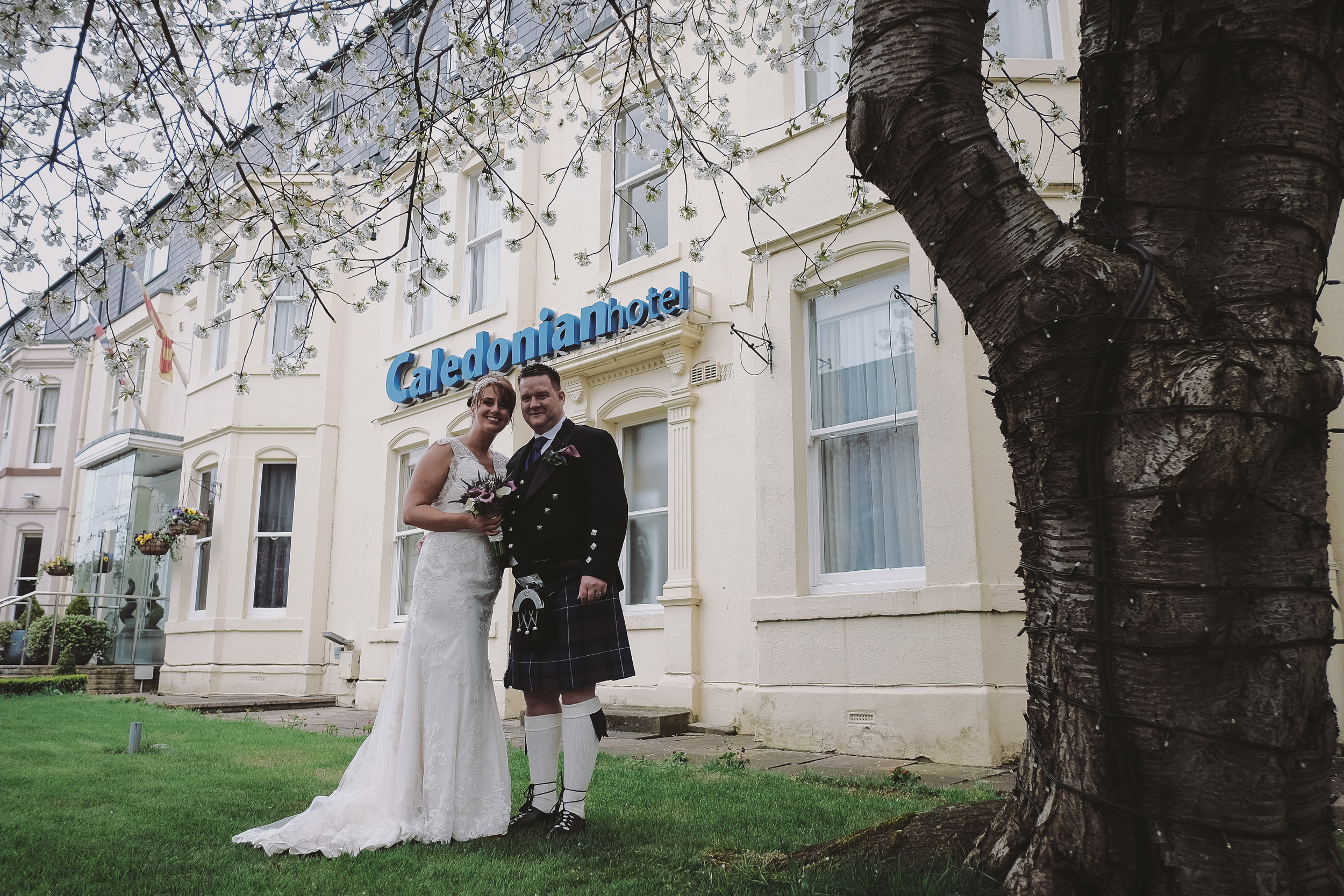 Newcastle Wedding Photographer // Bride and groom pose outside Caledonian Hotel