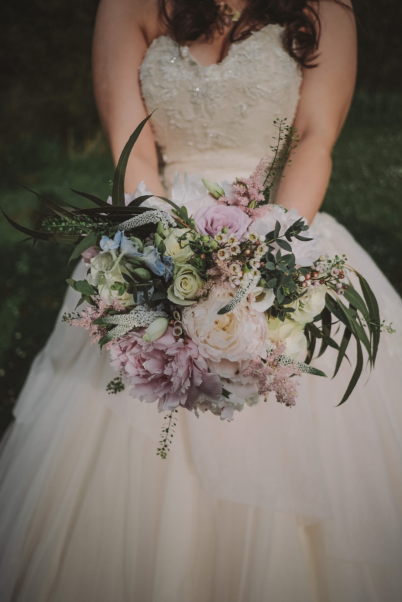 A close up of the bride holding the bridal bouquet at Newton Hall Northumberland by Barry Forshaw
