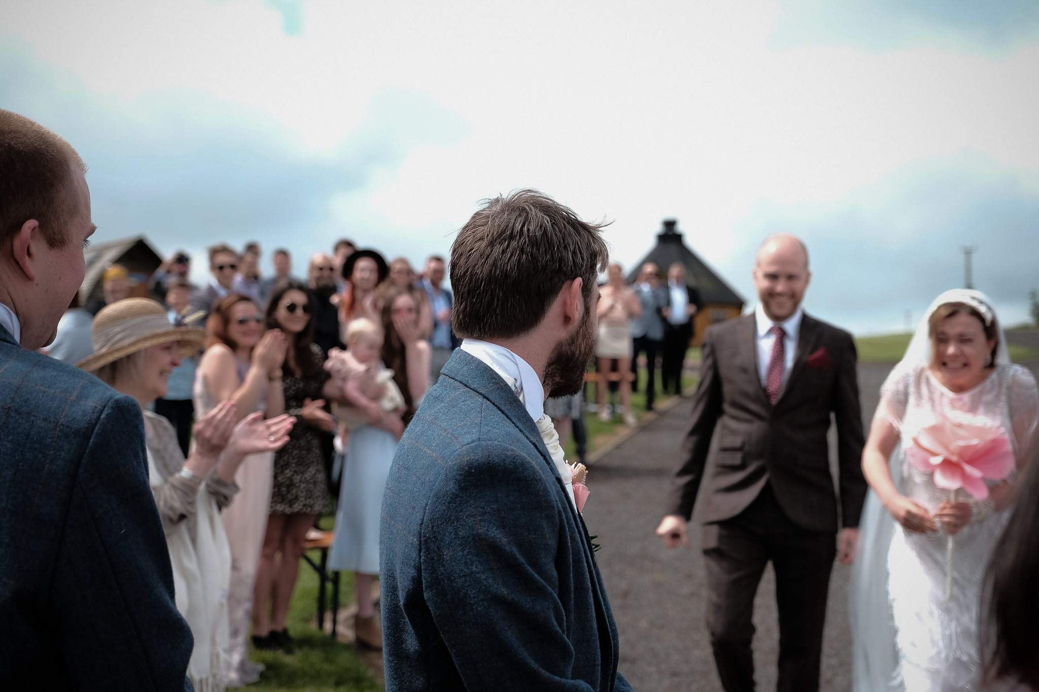 Bride and groom look at each other emotionally at the start of their wedding ceremony