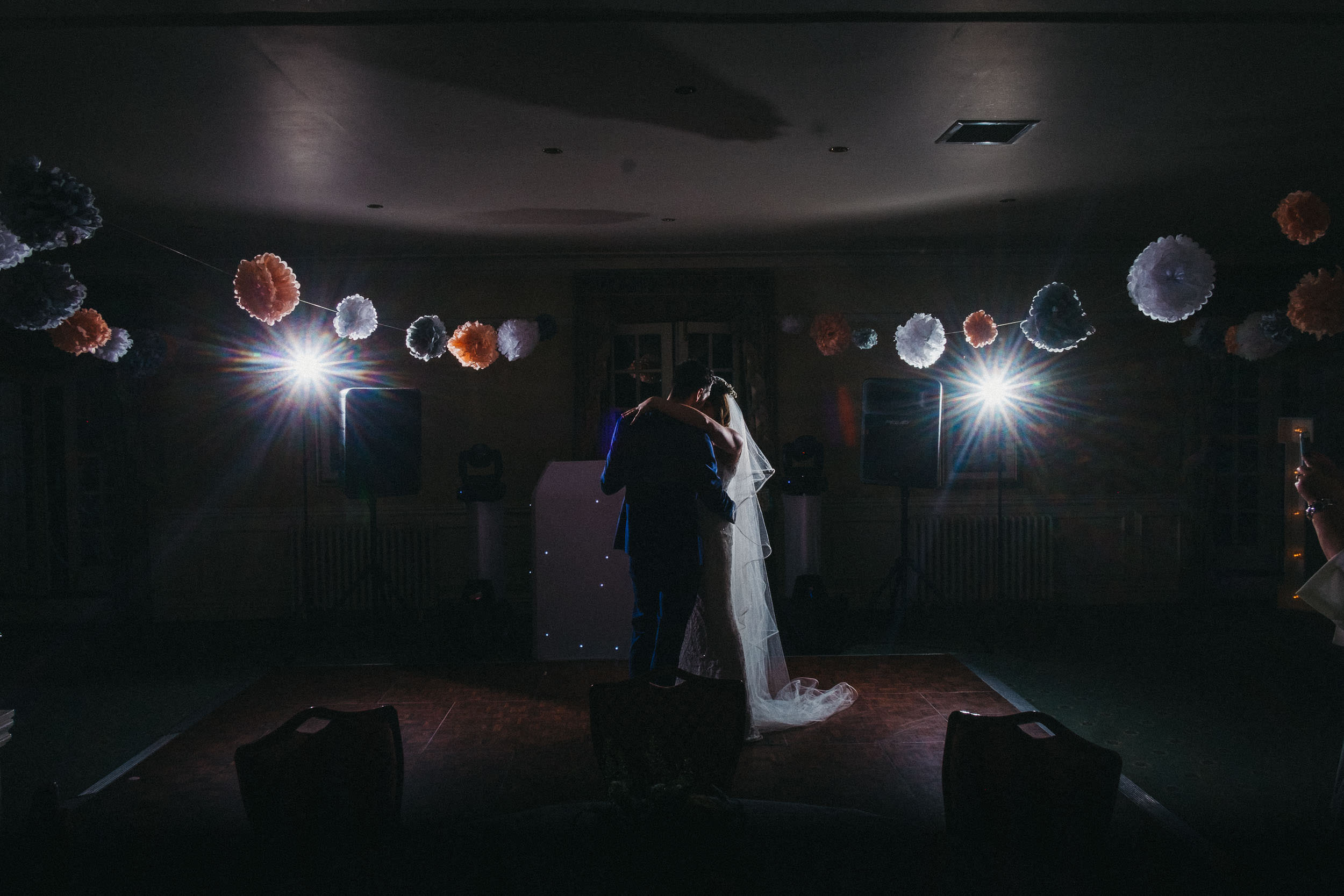 Dramatic photo of bride and groom first dance