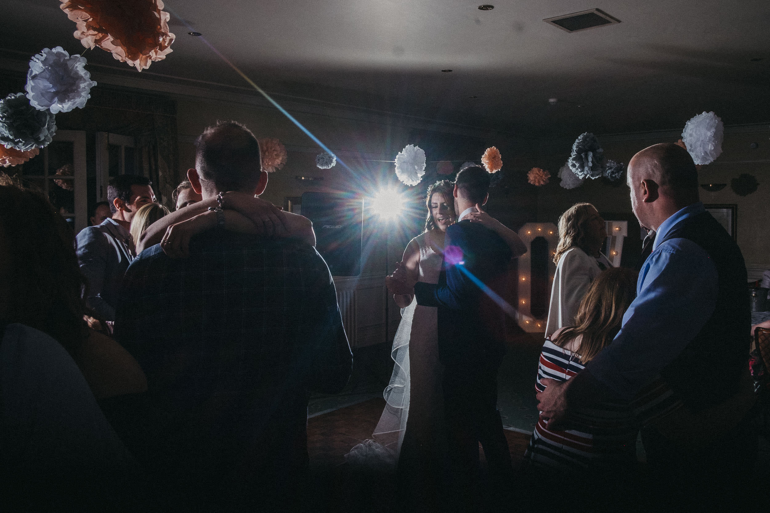 Guests join bride and groom on dance floor after first dance