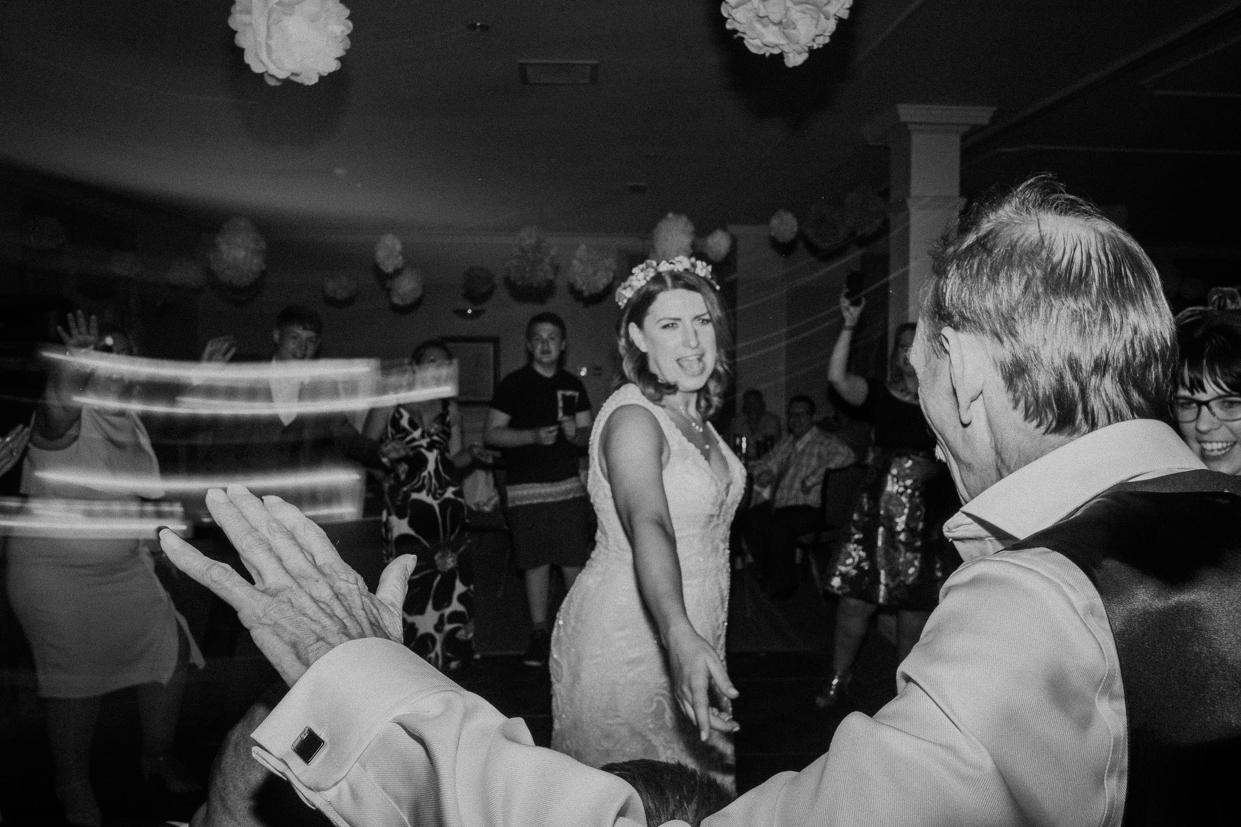Black and white photo of bride and father of the bride dancing
