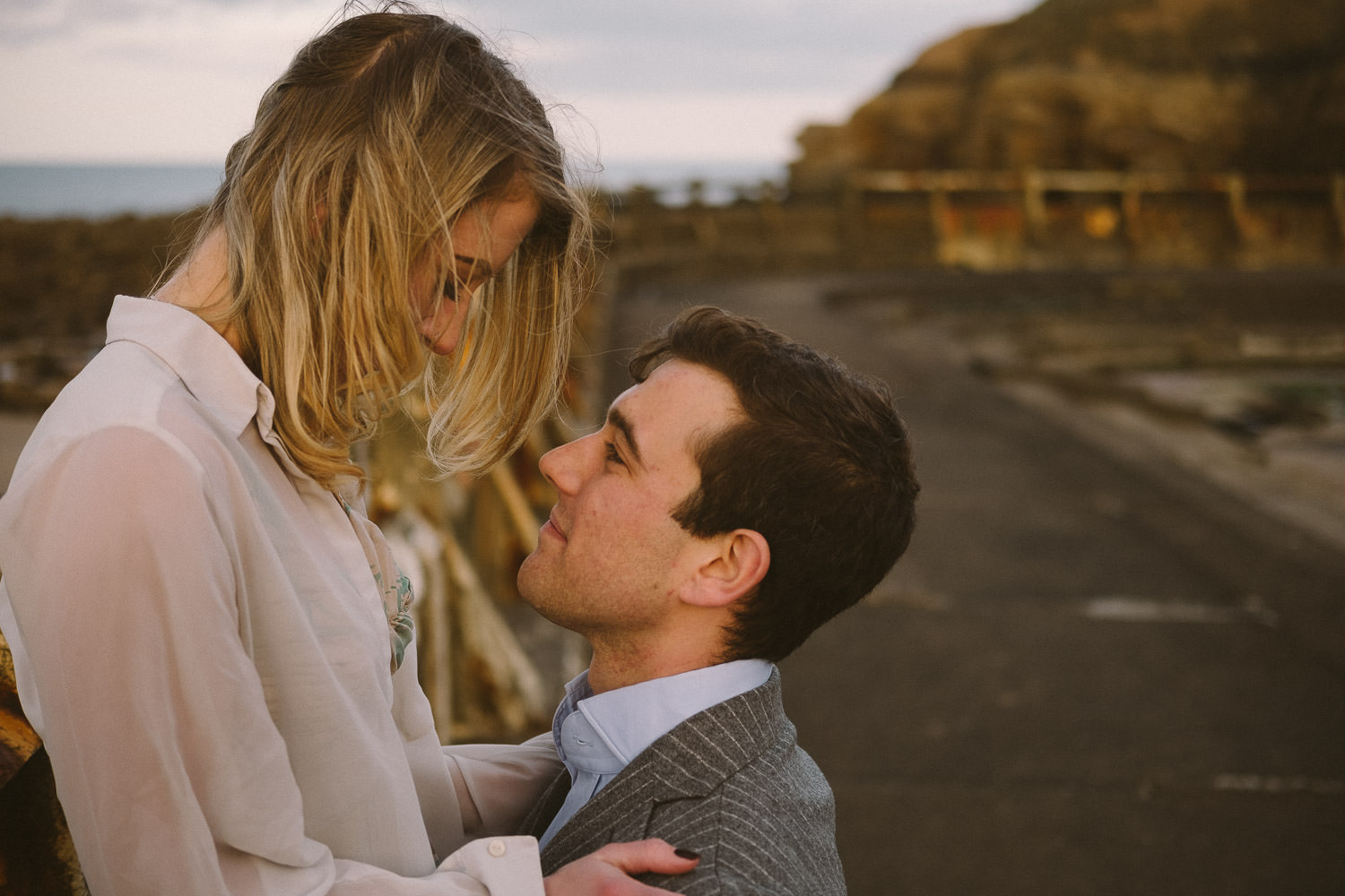 Engaged couple look tenderly into each other's eyes