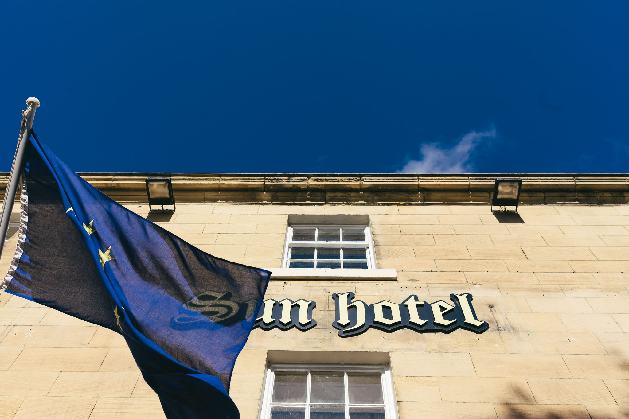 Sun Hotel sign and flag