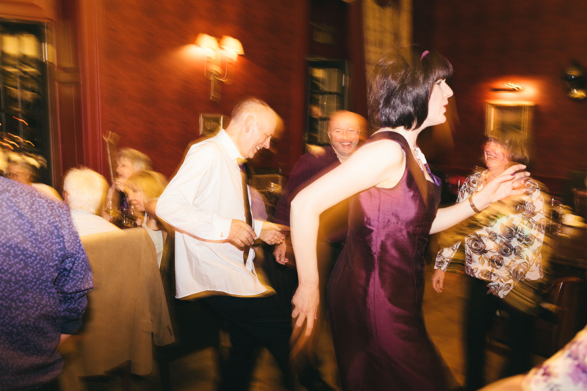 Bride and groom make funny shapes as they dance