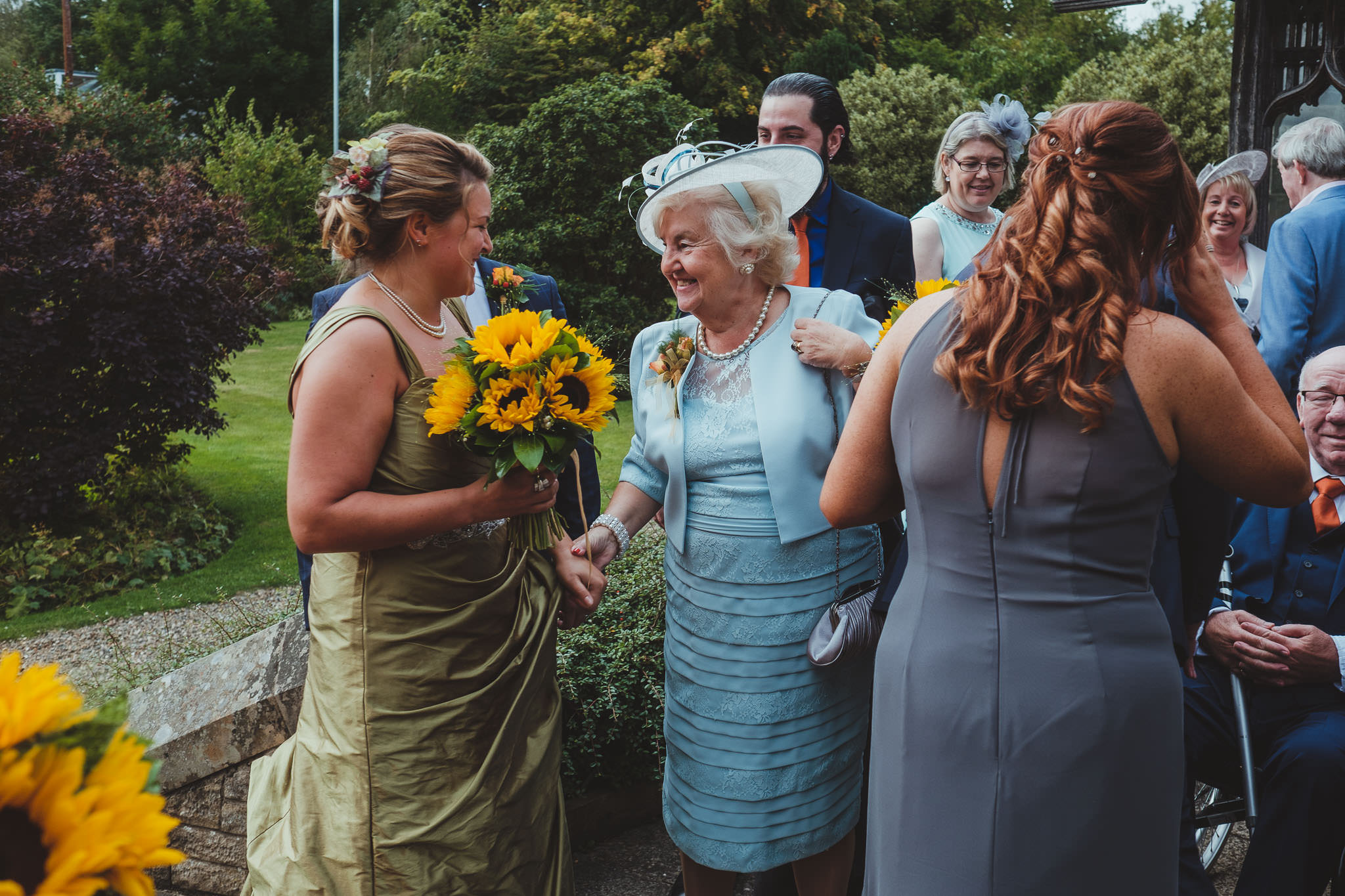 Bride greeted by mother of the groom after her wedding ceremony