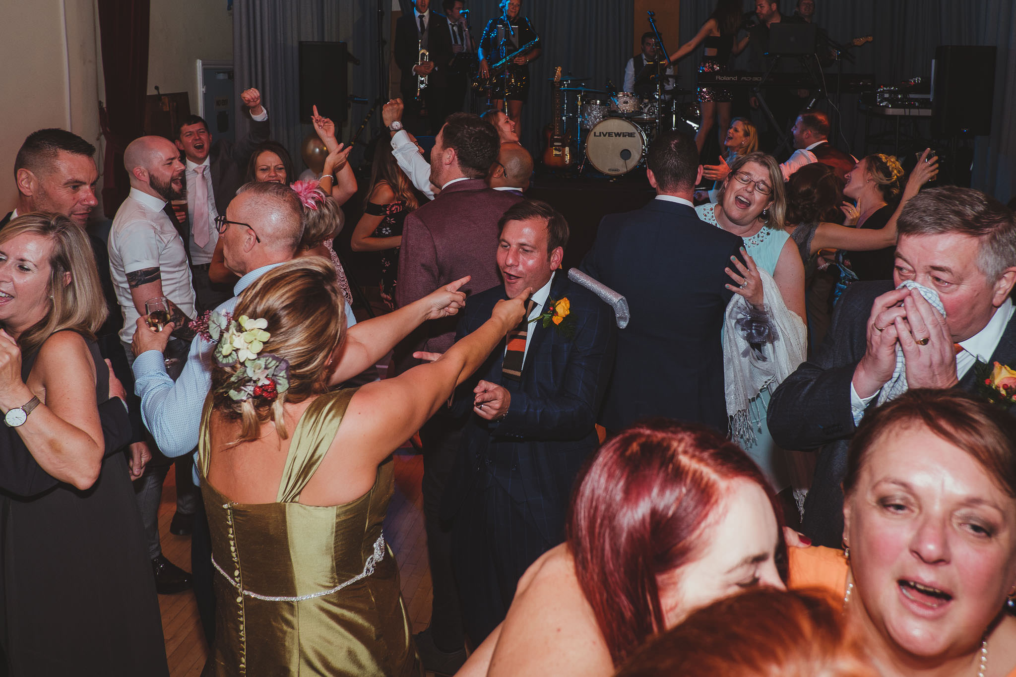 Bride and groom dancing amongst their wedding guests
