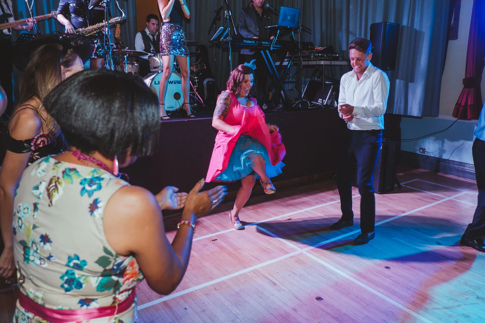 A wedding guest dances burlesque