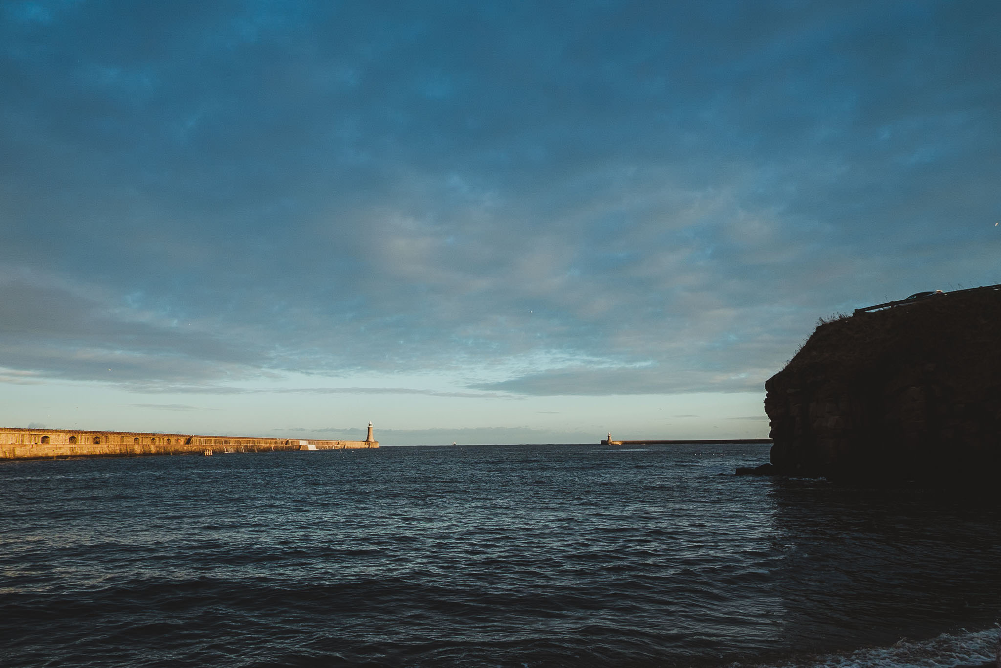Lighthouse and harbour wall at Tynemouth