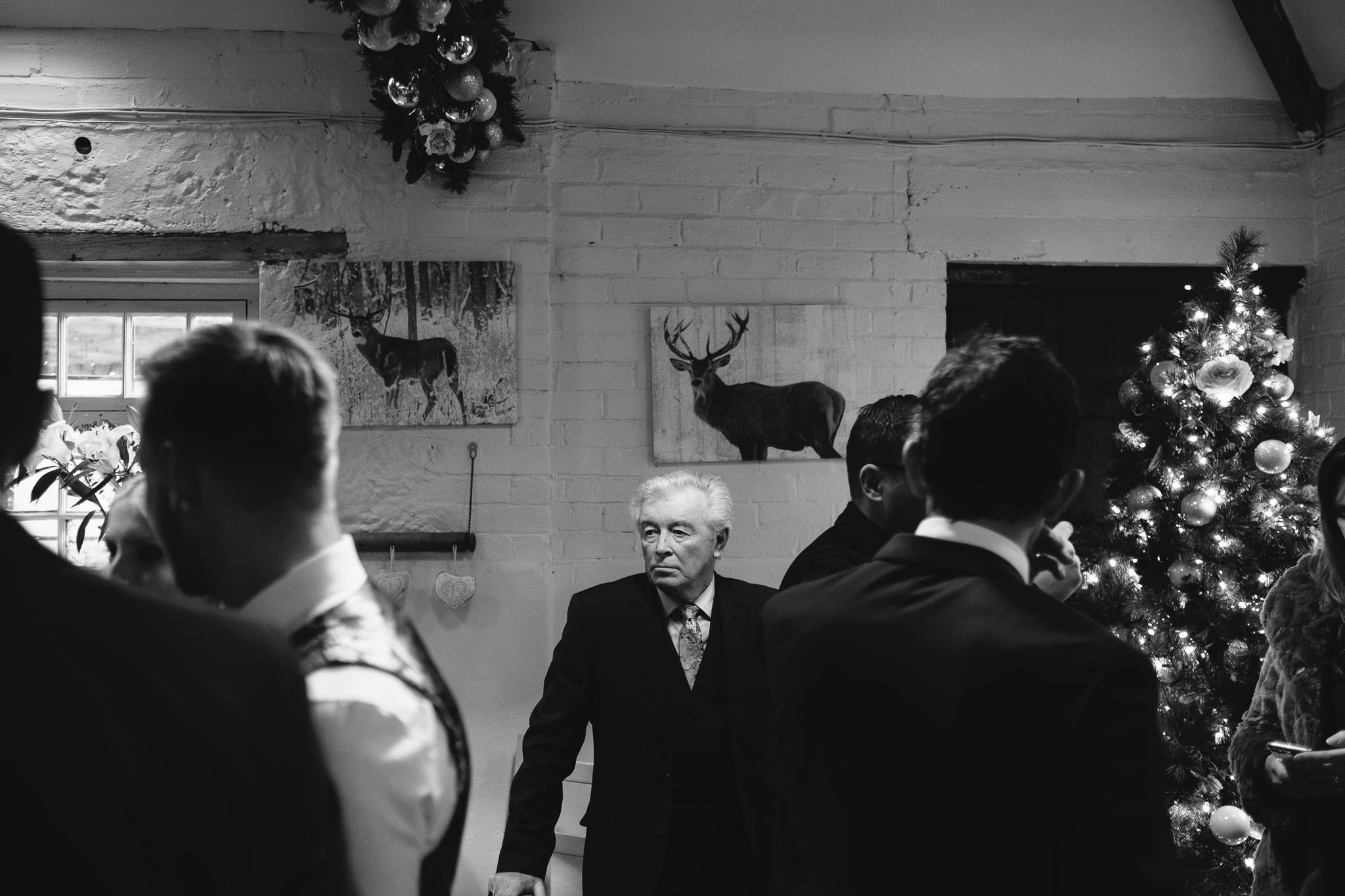 Black and white photo of older guest at wedding reception