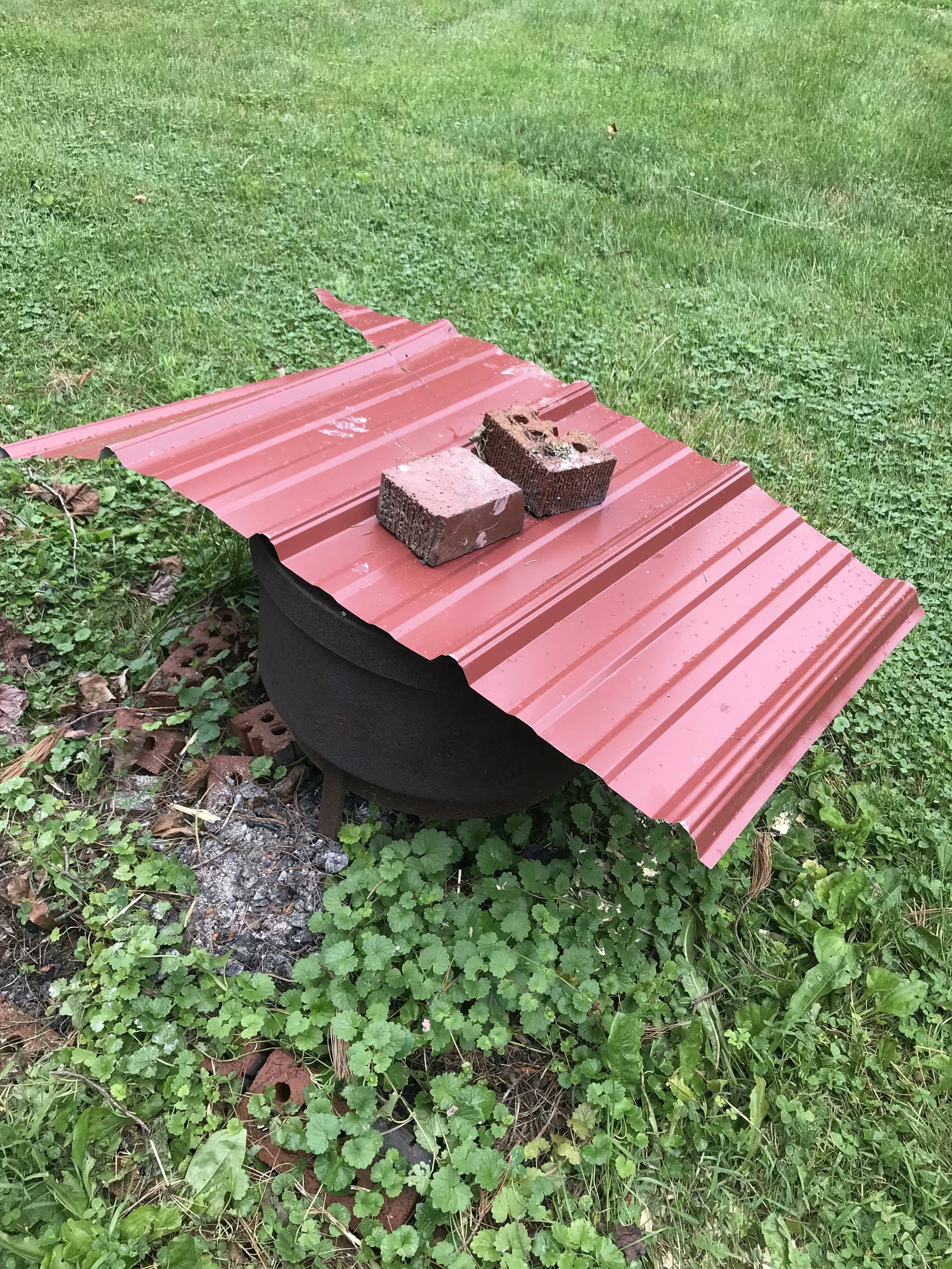 3. Cover the bin and begin the reduction process. Cover the trash bin to trap smoke and allow the pots to absorb it as they slowly cool down. This is known as the reduction process . Be sure to maintain a slow and steady cooling period—if the pots