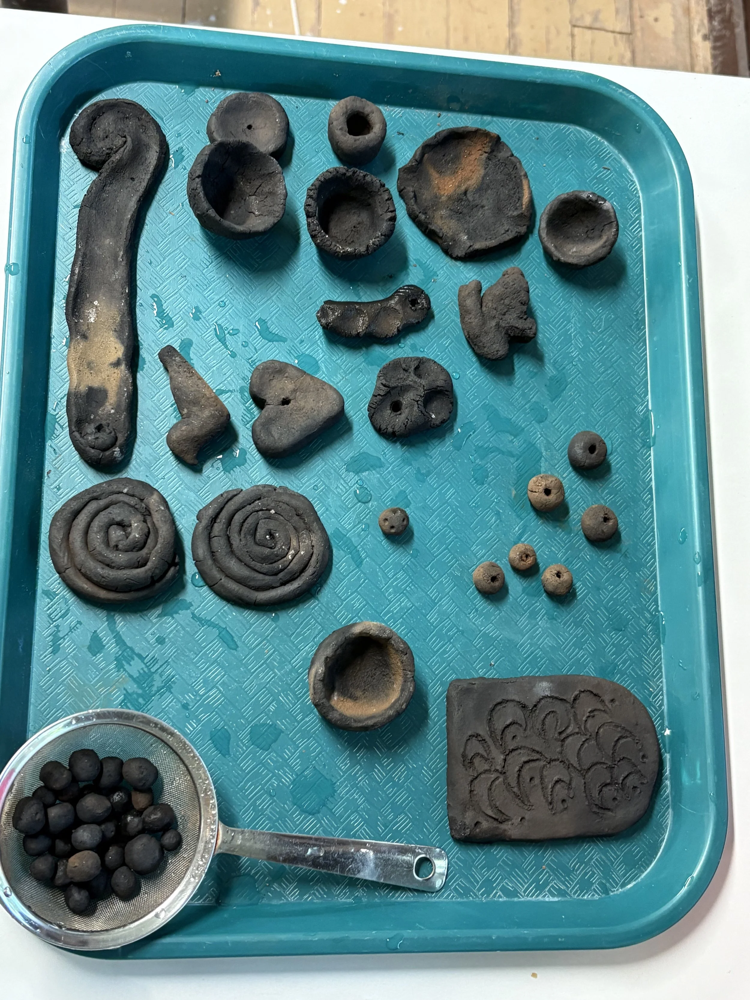 The results from our first group firing were a success—nothing broke! Each piece survived the firing intact and was returned to its creator, a tangible memory of our shared exploration with Hambidge clay.
