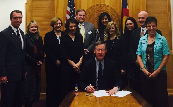Gov. Hickenlooper signs HB16-1224 with Aggorney General Coffman, Colorado Dept. of Human Services (CDHS), Colorado Coalition Against Sexual Assault (CCASA) and Sen. Laura Woods (R) and myself (L) in attendance. 