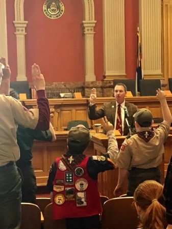 Representative Lundeen recites the Oath with BSA members