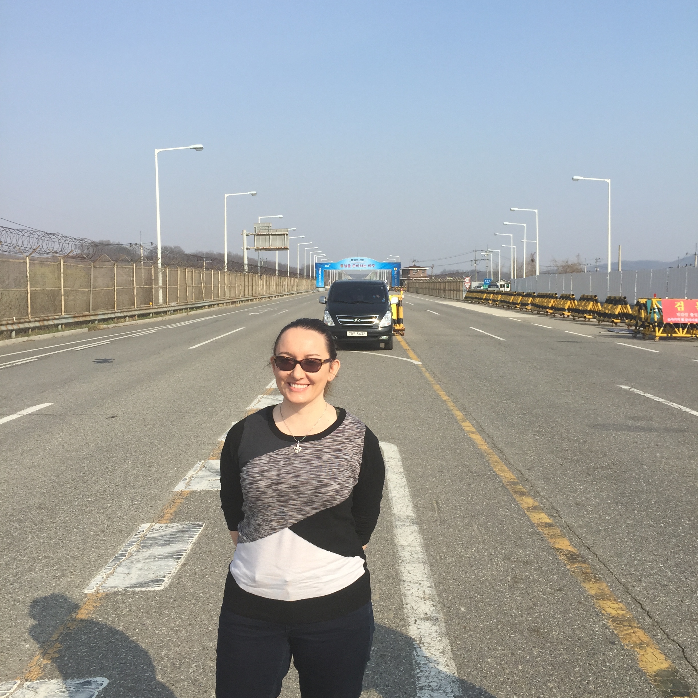 Me standing at the heavily fortified border crossing between North and South Korea (2015).