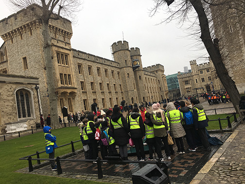 Students learn about the infamous scaffold site, where prisoners (and some Queens) were executed on the Tower of London grounds (©Deborah Clague)