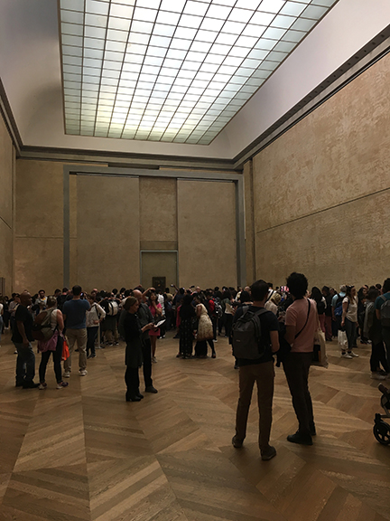 The Mona Lisa is located in a large room that contains no other pieces of art, Paris (©Deborah Clague).