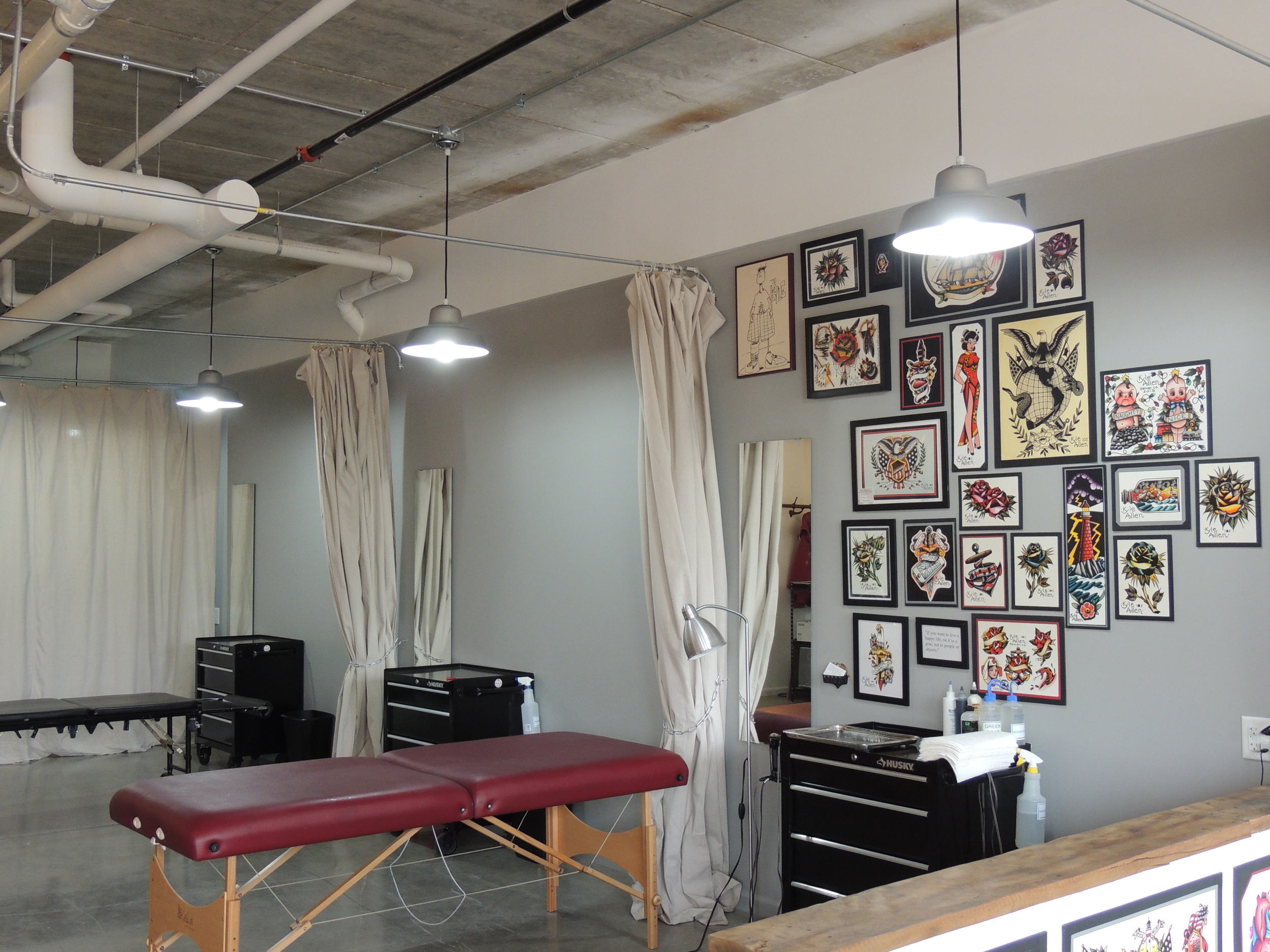 Tattoo parlor space within Benchmark Tattoo and Art Gallery.