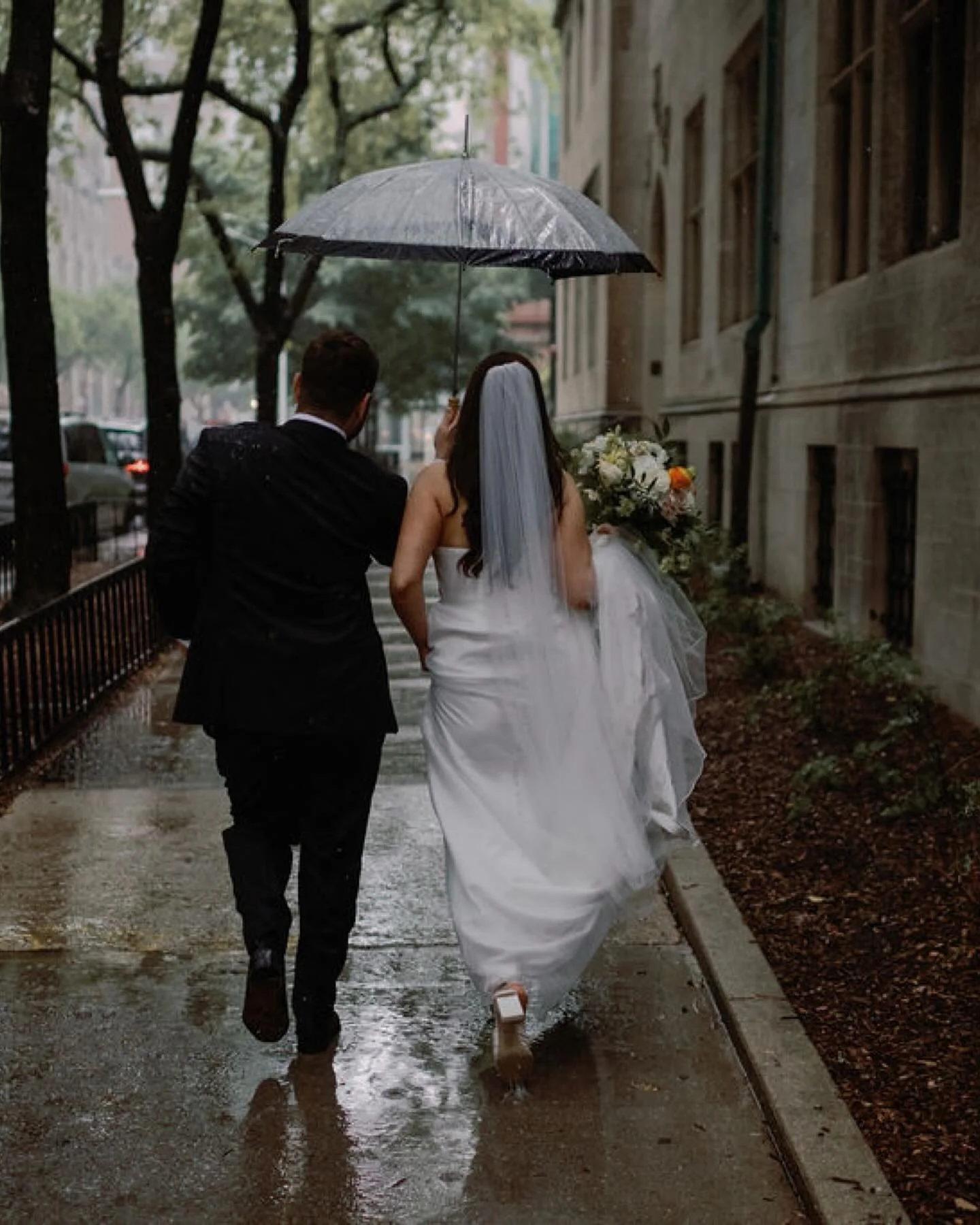 The storm today was making me reminisce on Allison and Jeremy’s rainy library wedding in the city…