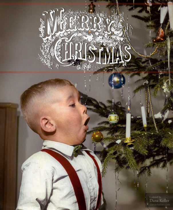 Boy Blowing Out Christmas Tree Candle