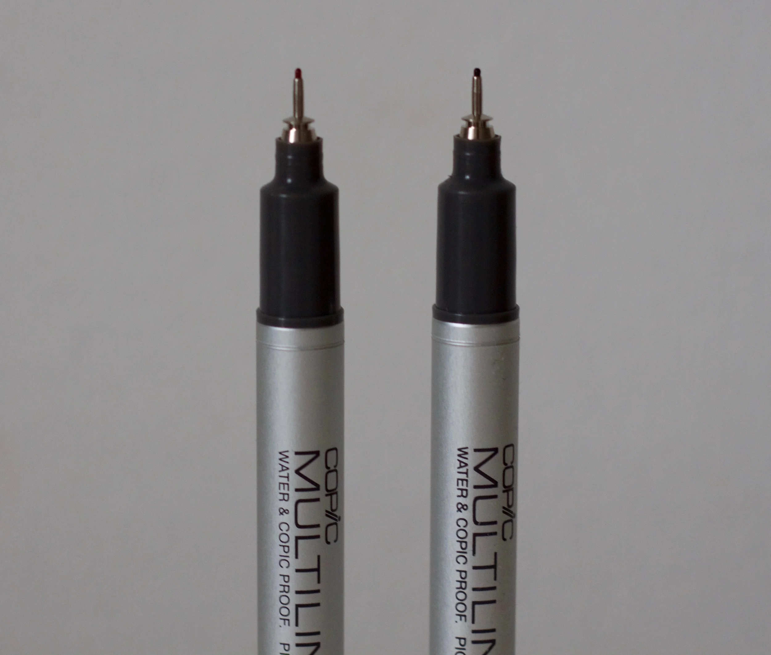 Sepia Copic Multiliner on the left and Black Copic Multiliner on the right